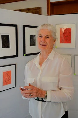 Jeannine, in front of some of the displayed silverpoints at "Evoking Ashantilly"