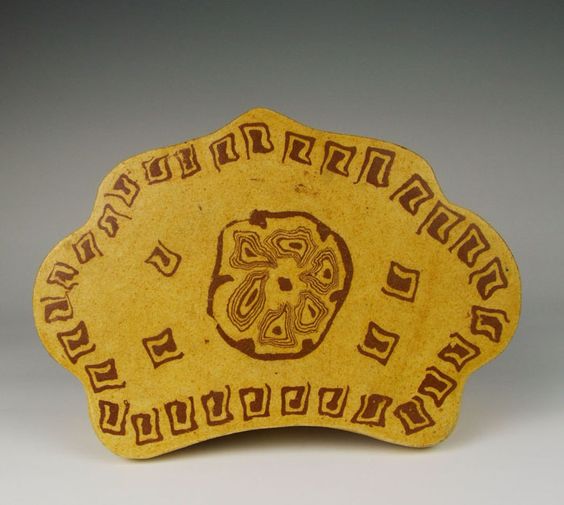 Tang Dynasty Changsha ware yellow glaze pottery. Headrest with interwisted-clay design.
