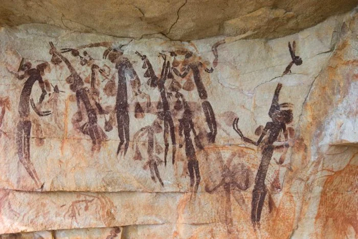 Gwion Gwion (Bradshaw) paintings on a rock wall.