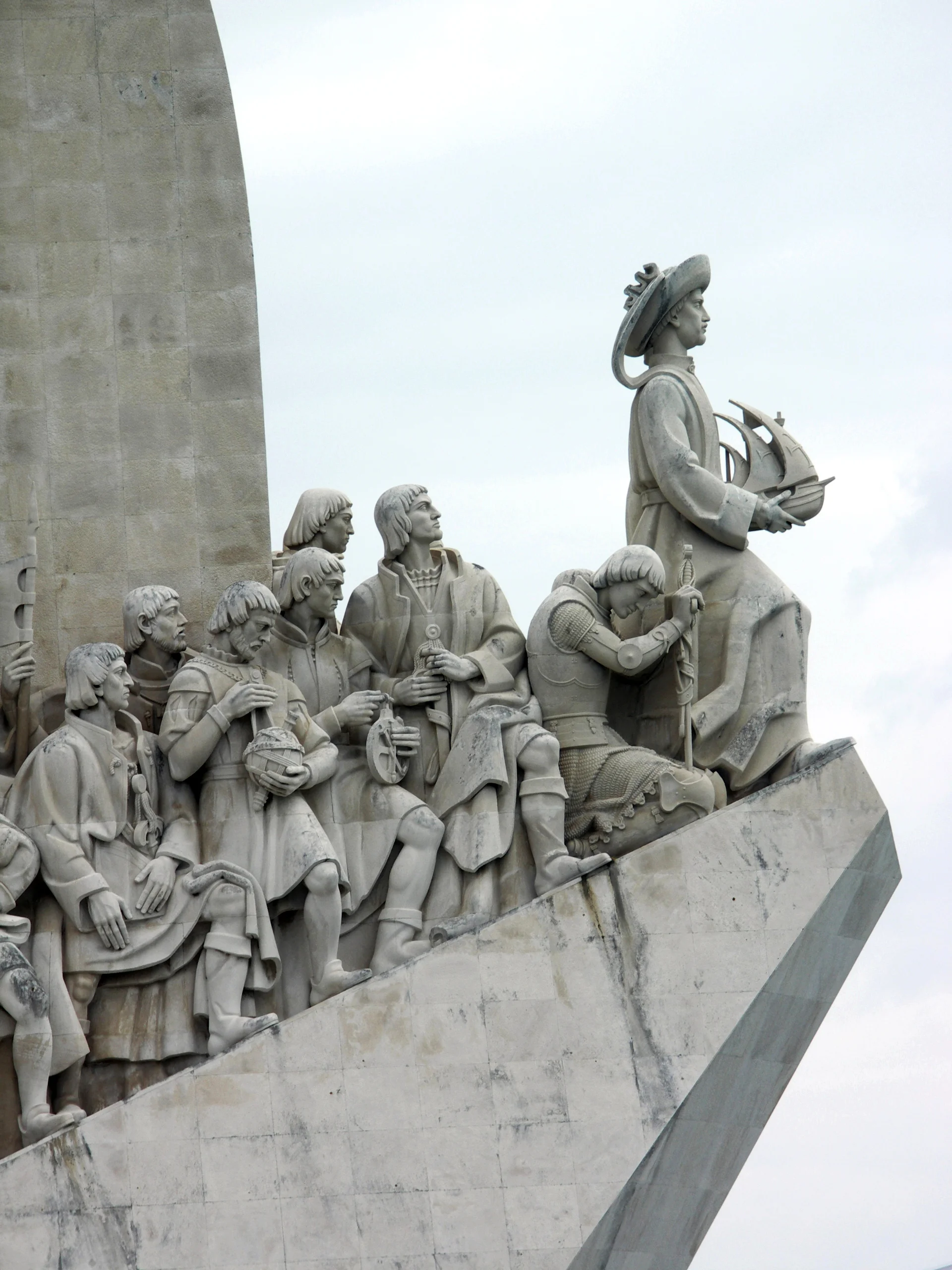 Detail of some of the 33 figures depicted amongst the leaders in the Age of Discovery, with Henry the Navigator holding a carrack at the top of the ramp, Monument of the Discoveries, Lisbon