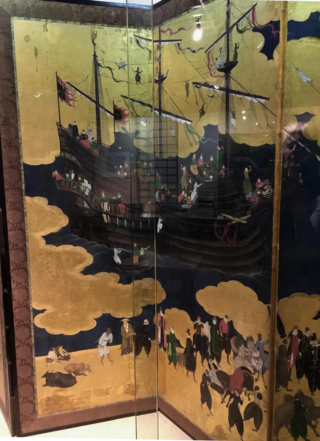 Detail of Portuguese ship. Namban screen. Stamp of Kano Naizen, Japan, 1593-1602, Monoyama Period, tempera on paper, gold leaf, silk, lacquer, metal. Museu de Arte Antiga, Lisbon. ((Photograph J. Cook)