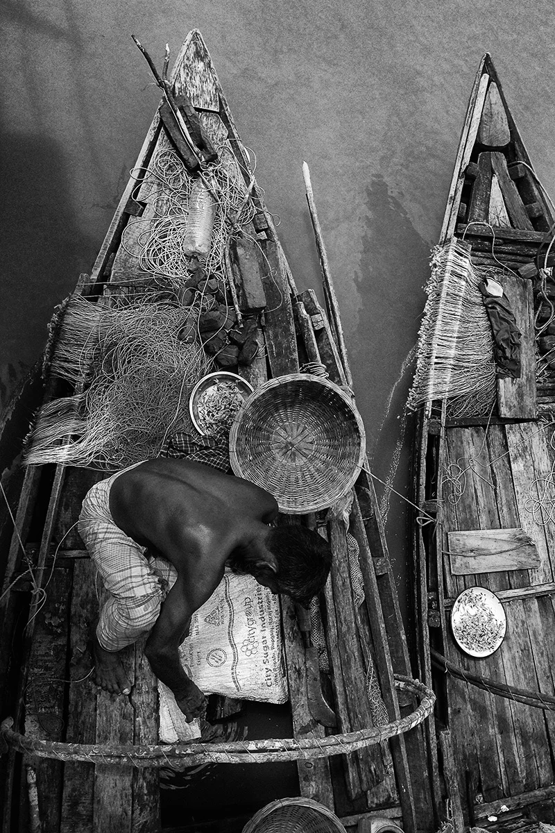 This long-line fisherman will spend ten days on the boat, in the forest, braving tigers and crocodiles, to make a meager living. Most of these small artisanal fishers make less than $1 a day.