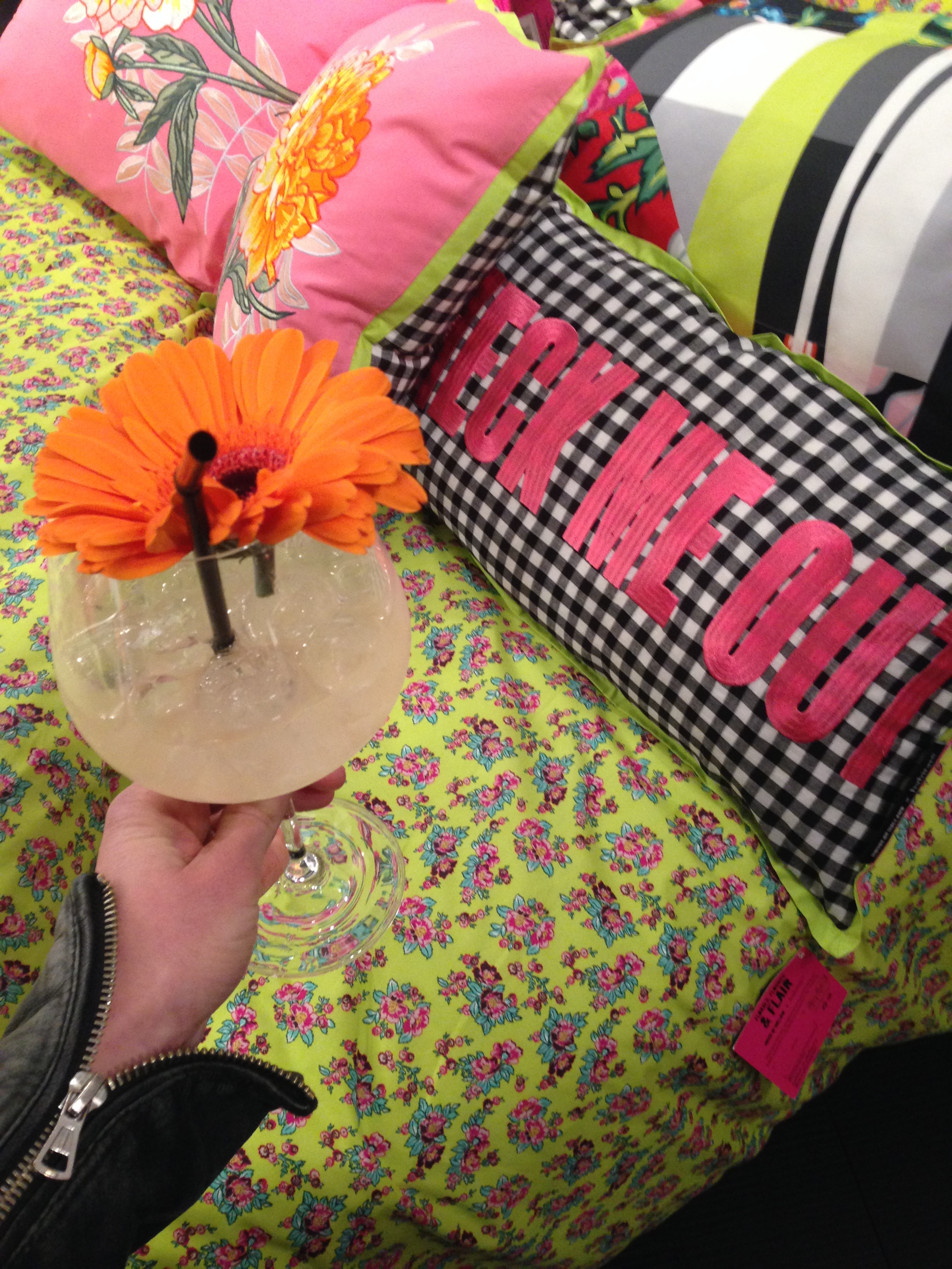 The House of Holland x Habitat bedding and gingham slogan cushion accessorised here with novelty cocktail.