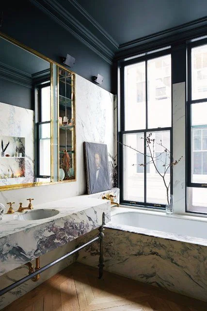 Jenna Lyons' marble, brass and black bathroom via T Magazine