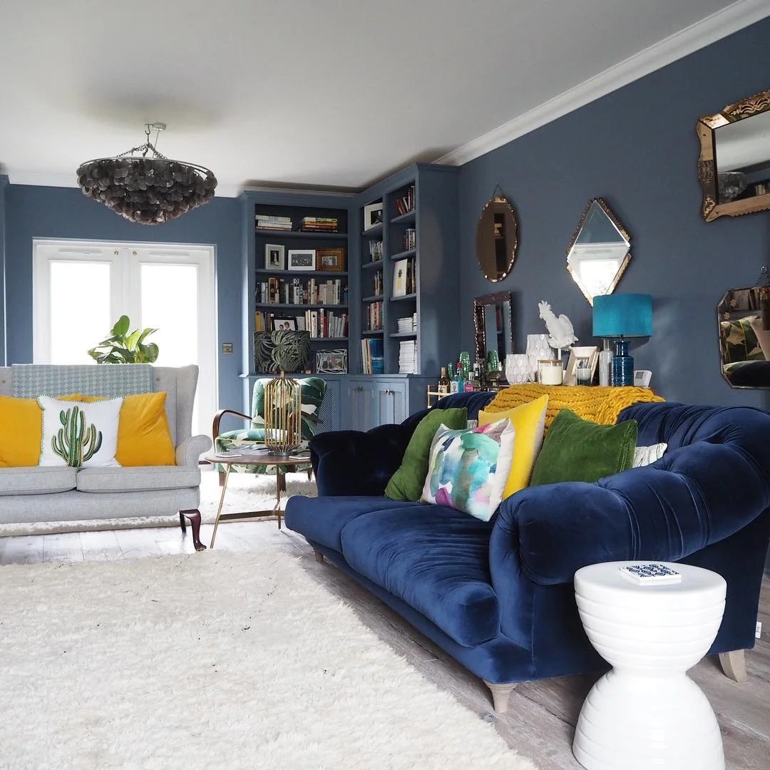 Erica's collection of Venetian glass mirrors have pride of place on her living room wall