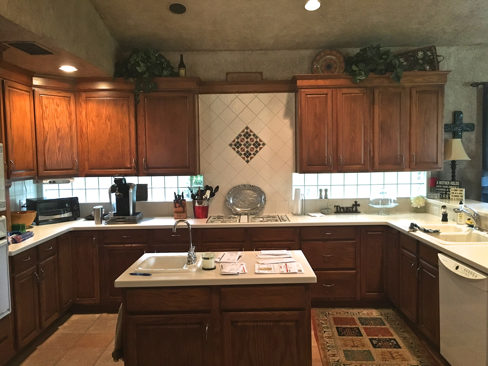 Before: Small island, straight lay tile floors, tricky configuration, and a lot of rectangular angles 