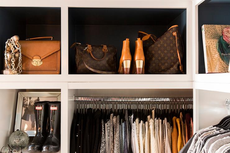 Louis Vuitton bags displayed beautifully in a very lucky woman's closet <3