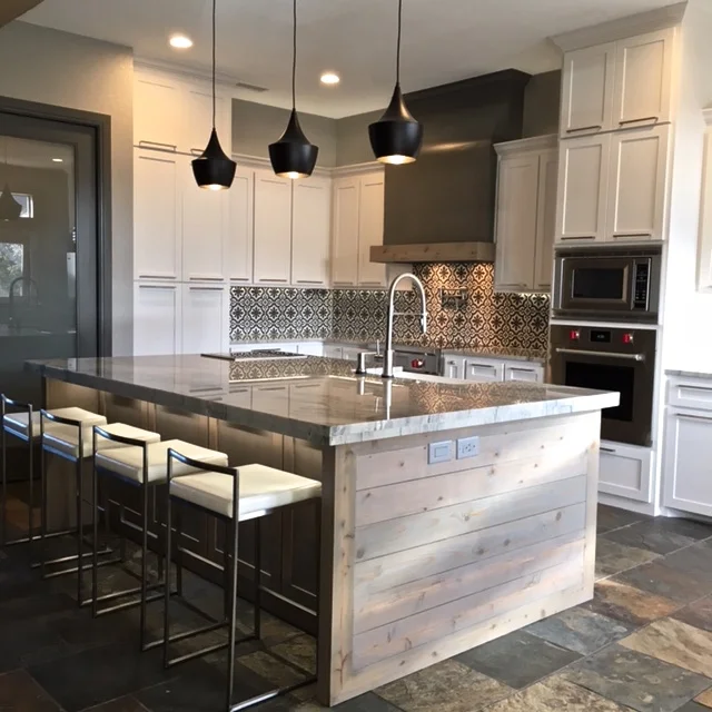 After: I extended some of the cabinets to the ceiling to create a variation of scale. The ceilings were tall and the space was long, so it was important to break up the space and give Molly more storage. 