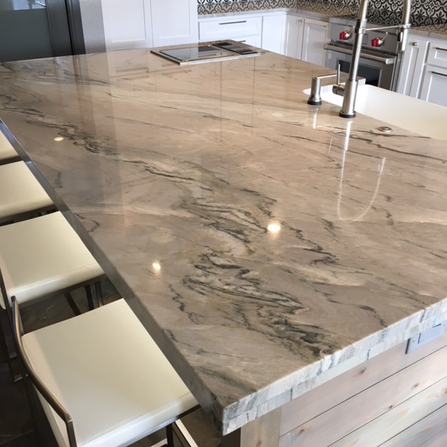 Brazilian Quartzite, teppanyaki grill, touch activated faucet and soap pump. 
