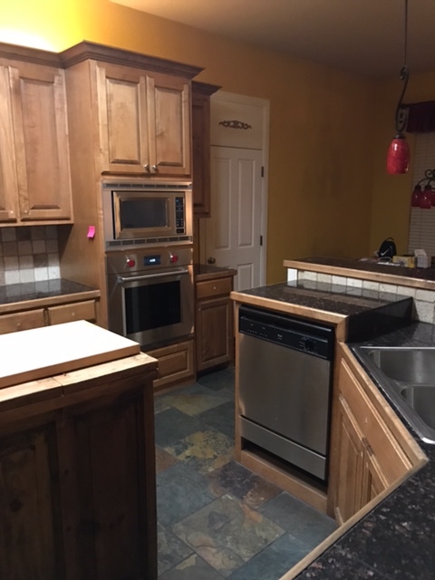 Before: Raised dishwasher and more wasted space 