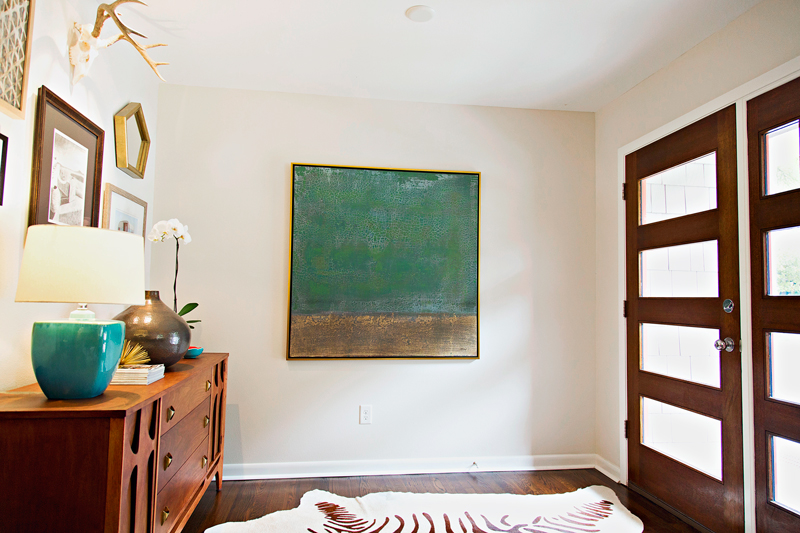 After: Refinished original hardwoods, front door is where she's supposed to be <3