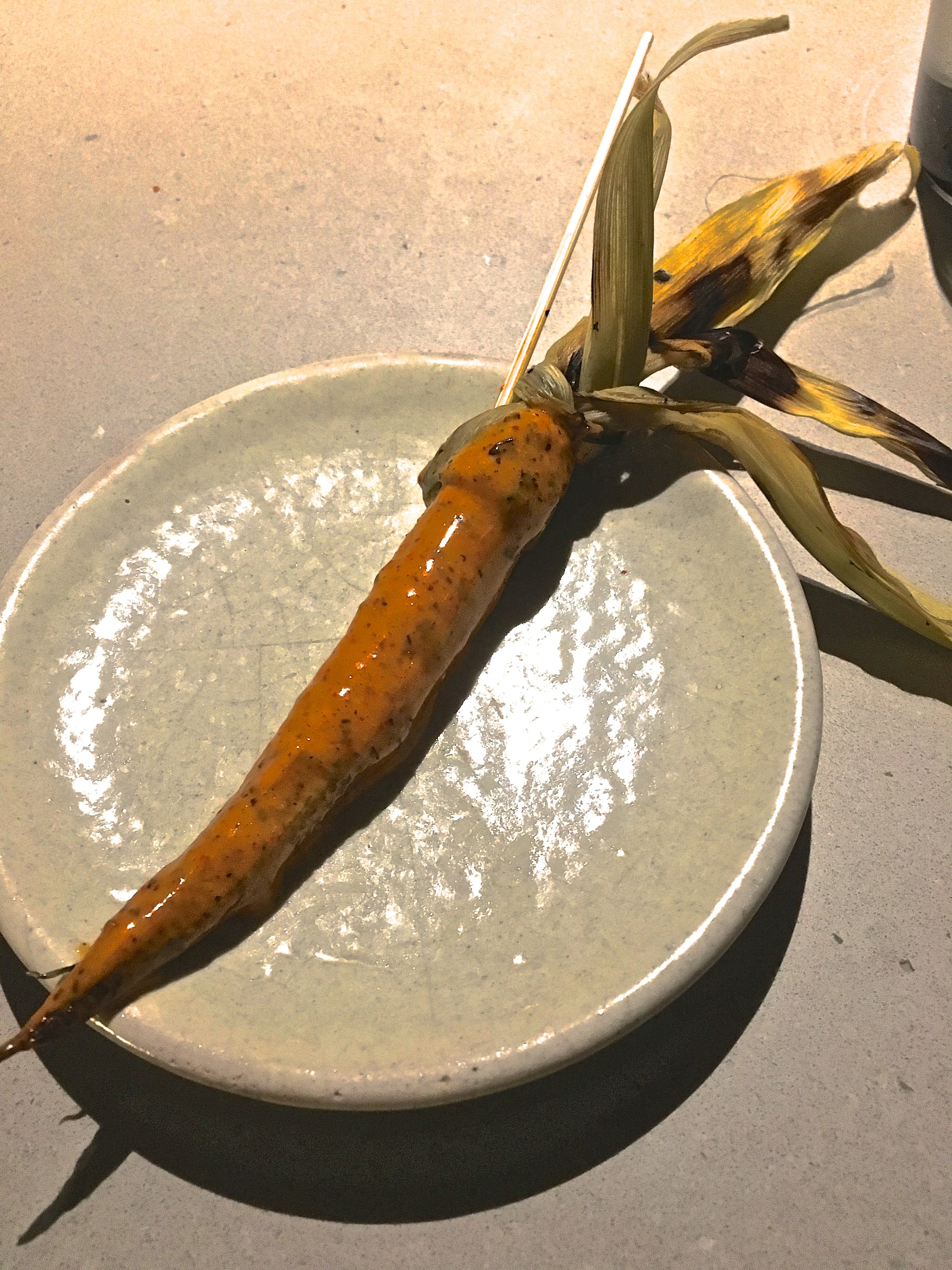 Elote dipped in a sauce made of ground ants. Yes, you read that correctly. 