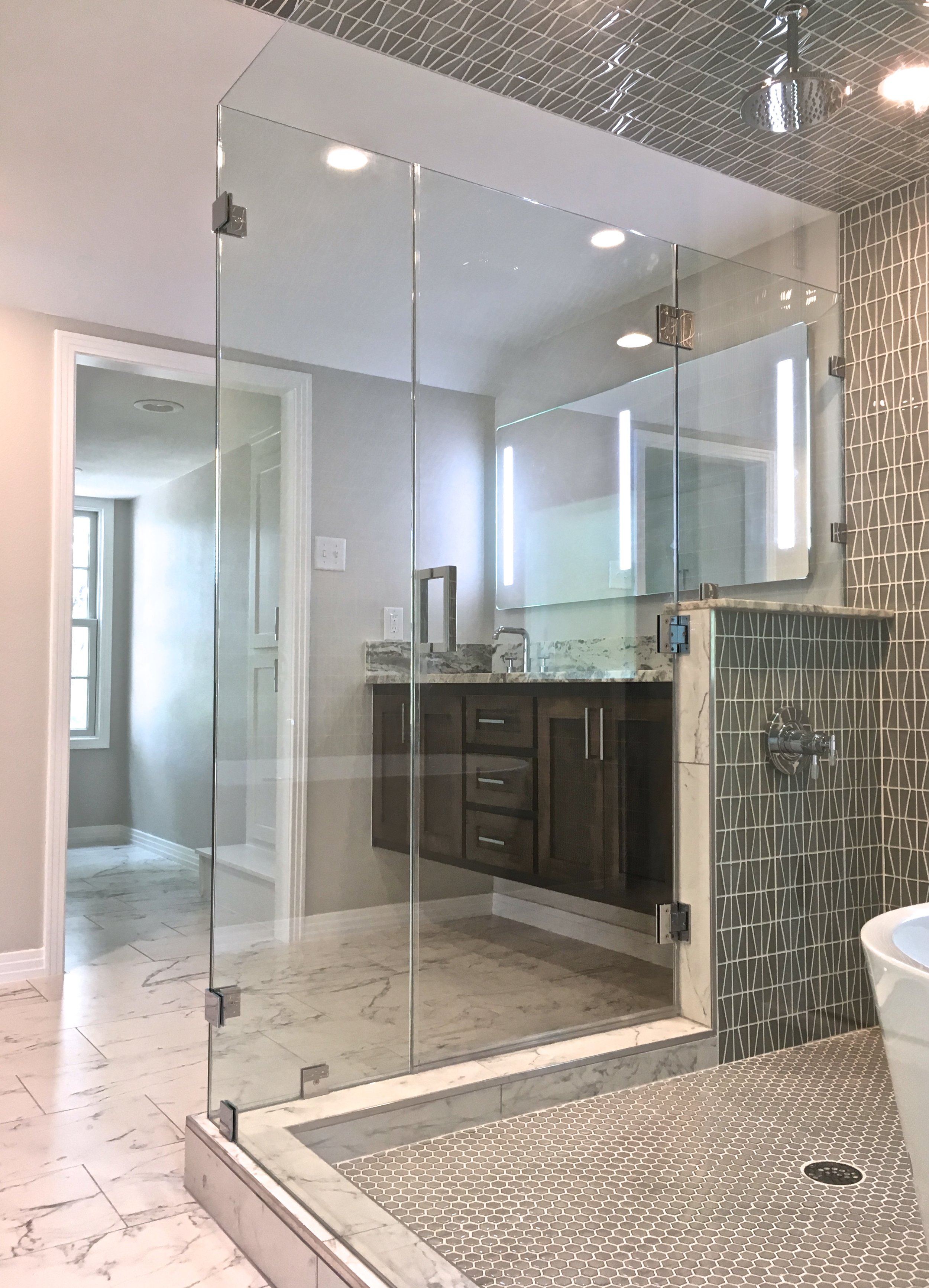 After: Floating vanity, free standing mirror with built-in LED lighting. 