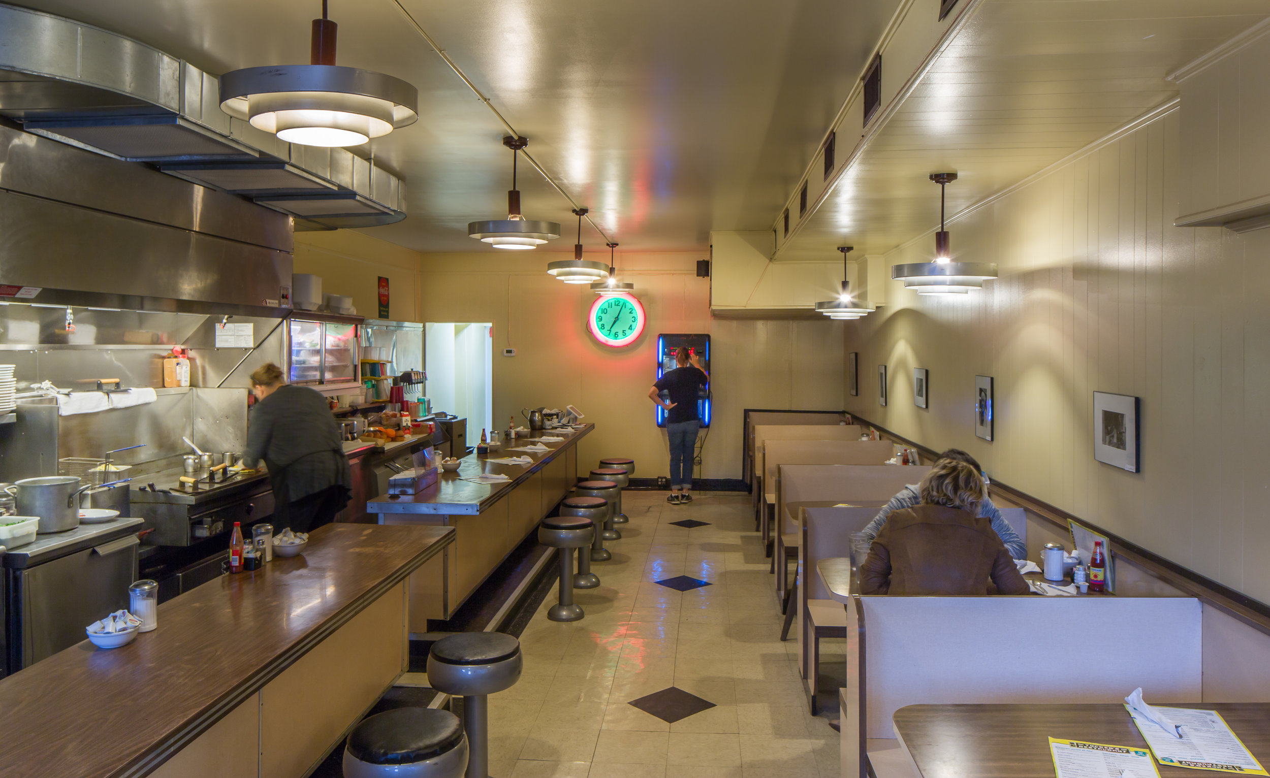 The rear kitchen was badly fire-damaged, and almost entirely rebuilt, along with the bathroom. The front was mostly unscathed, and we worked to carefully preserve and restore much of the old equipment and fixtures. A new hood and safety equipment were badly needed though.