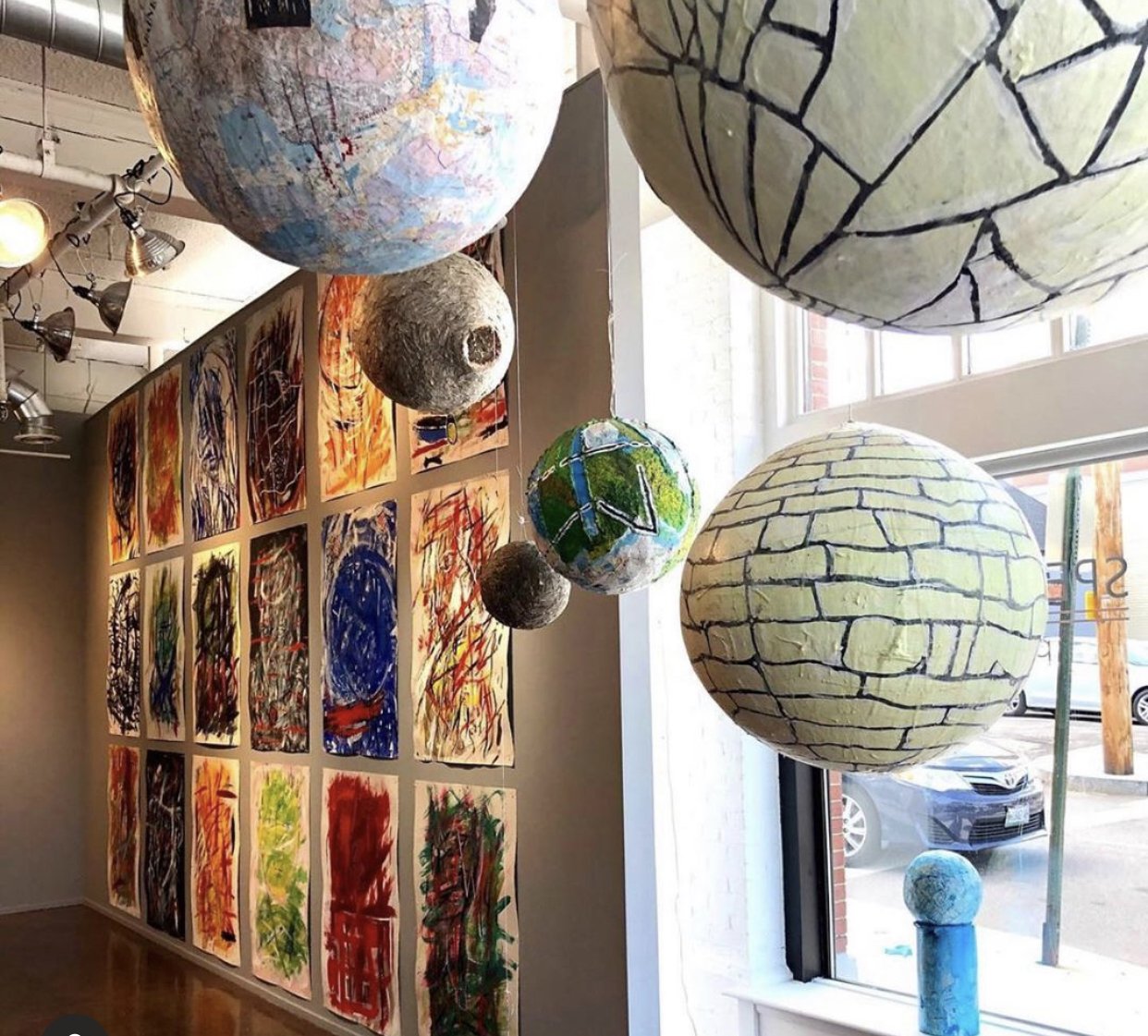 Abby Shahn-Fifty Years Installation shot of globes and Large Heads.jpeg