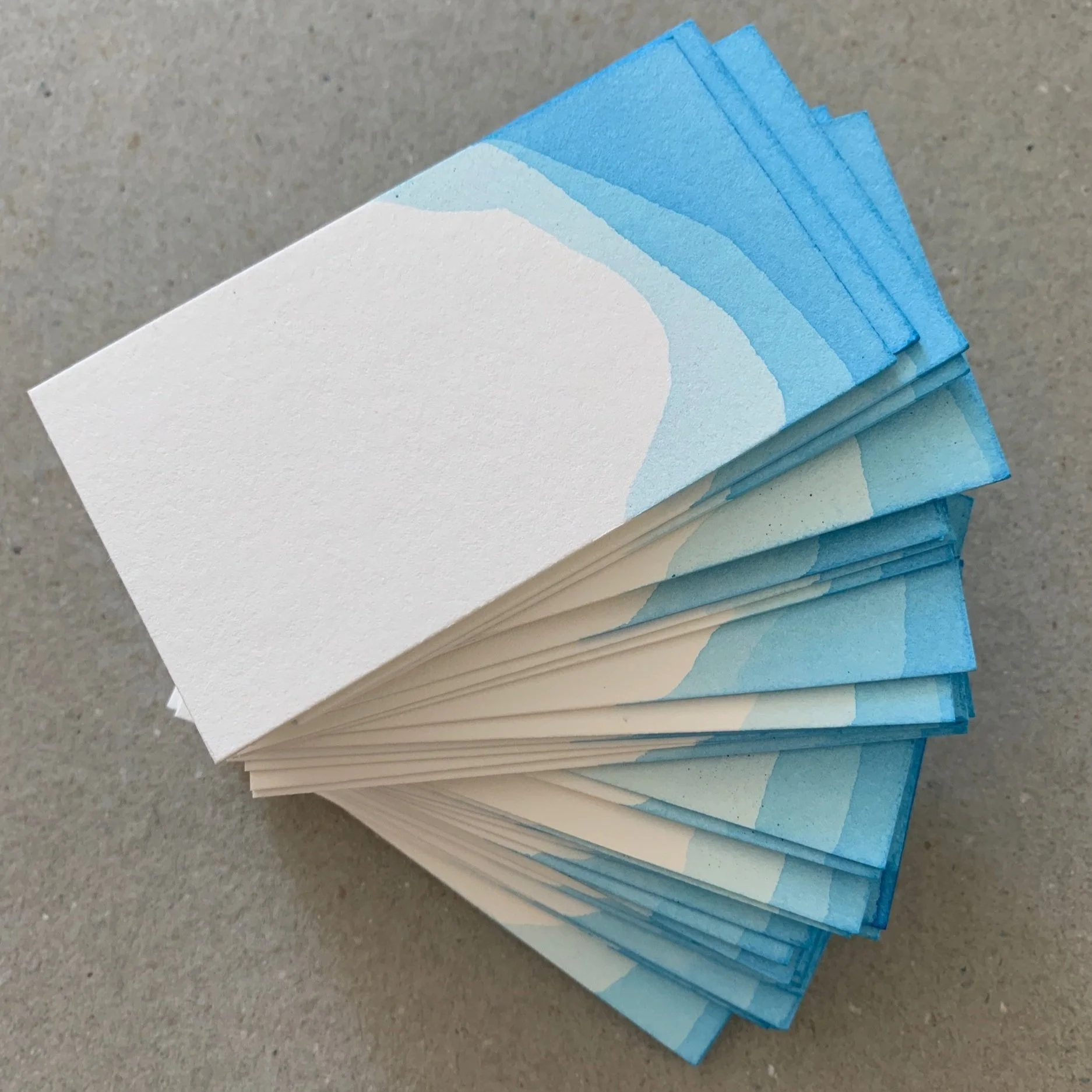 A pile of dip-dyed place names ready for lettering.