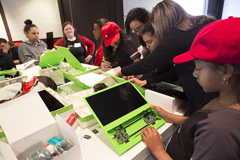 During the final day of Co.Lab, students presented their work to Mayor Marty Walsh, demonstrating how they converted Raspberry Pi computers into digital cameras and showcasing their final setting of Hope is the Thing with Feathers .