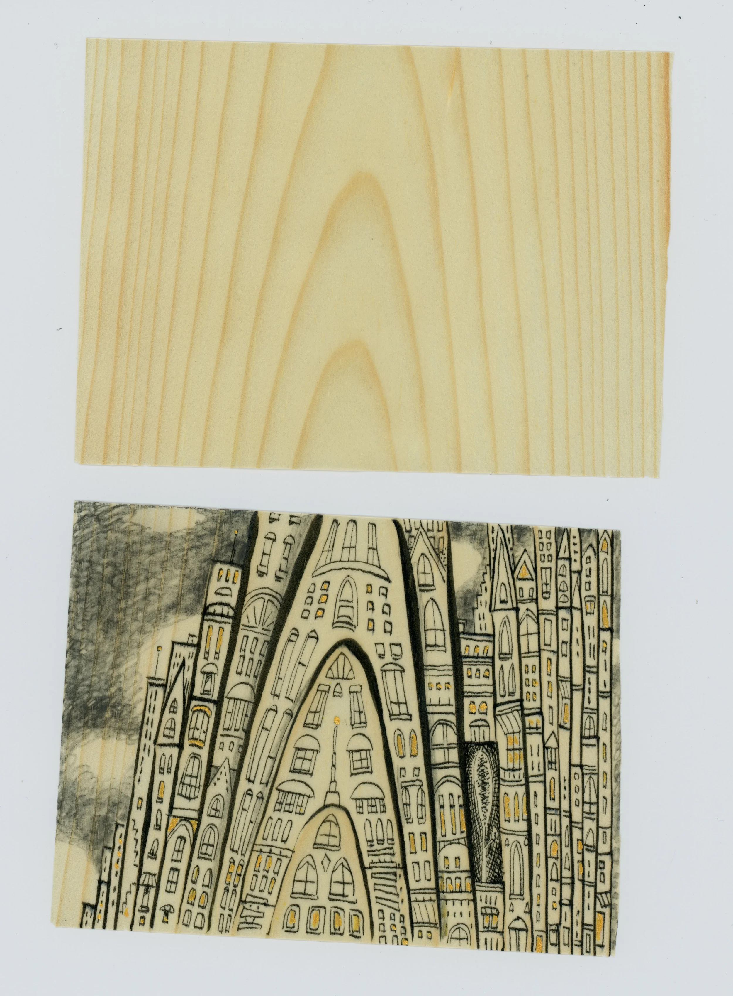 Drawing on wooden sheets of "paper"... above the drawing is a sample sheet. See the grain of the wood?