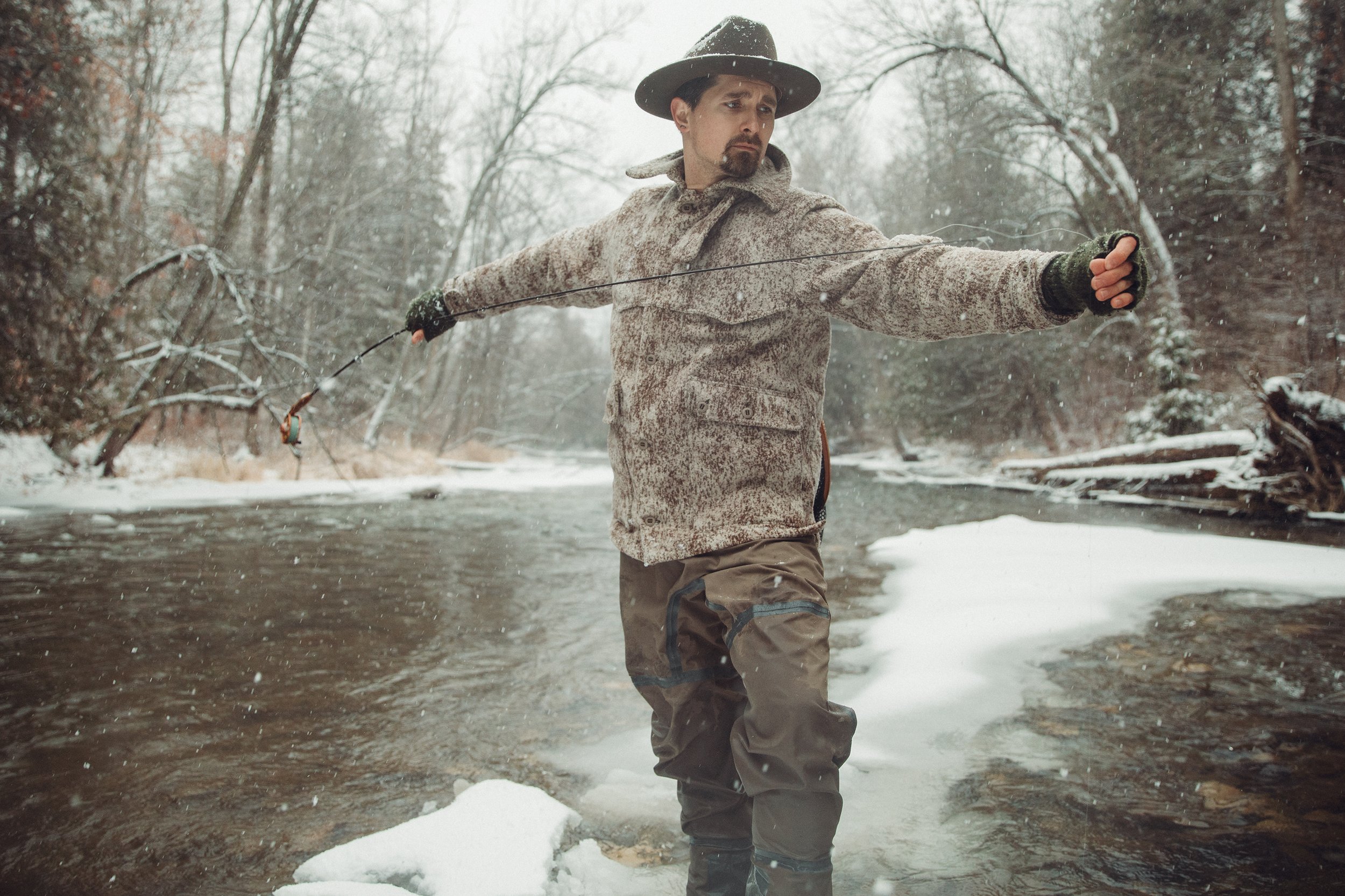  Cody Bokshowan fly fishing on his home river in his Lynx Pattern All Around Jacket from WeatherWool. 