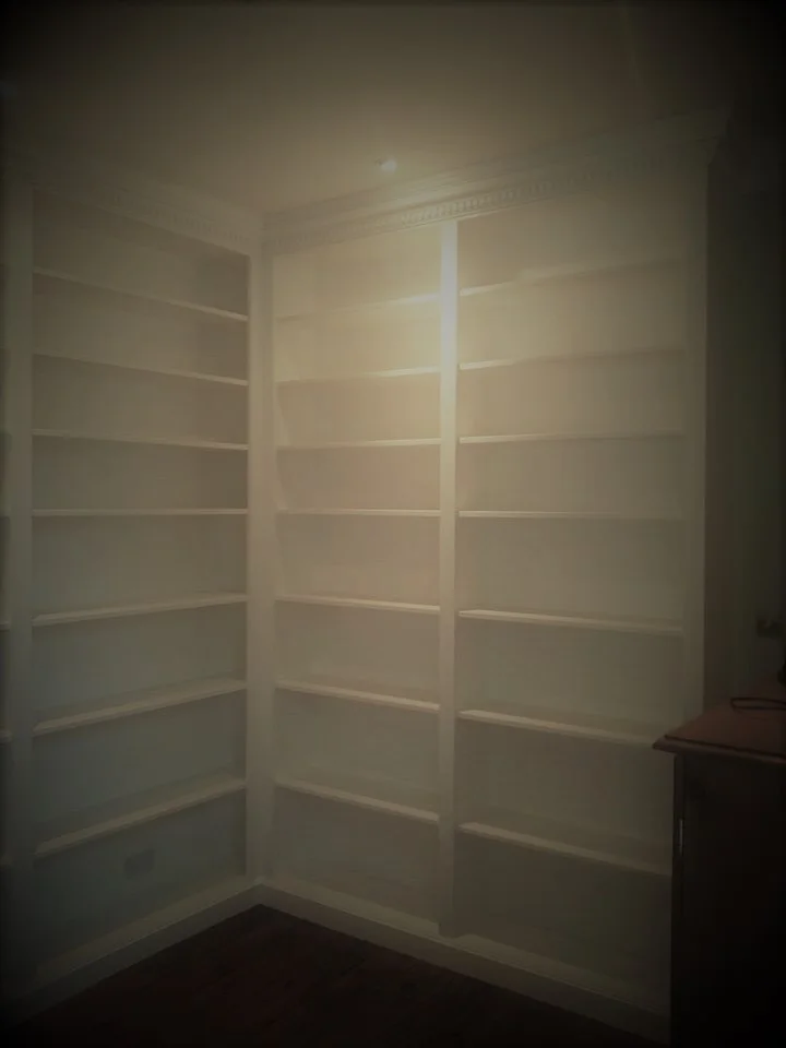 This bookcase is fitted with a matching coving to bring the unit into the room.