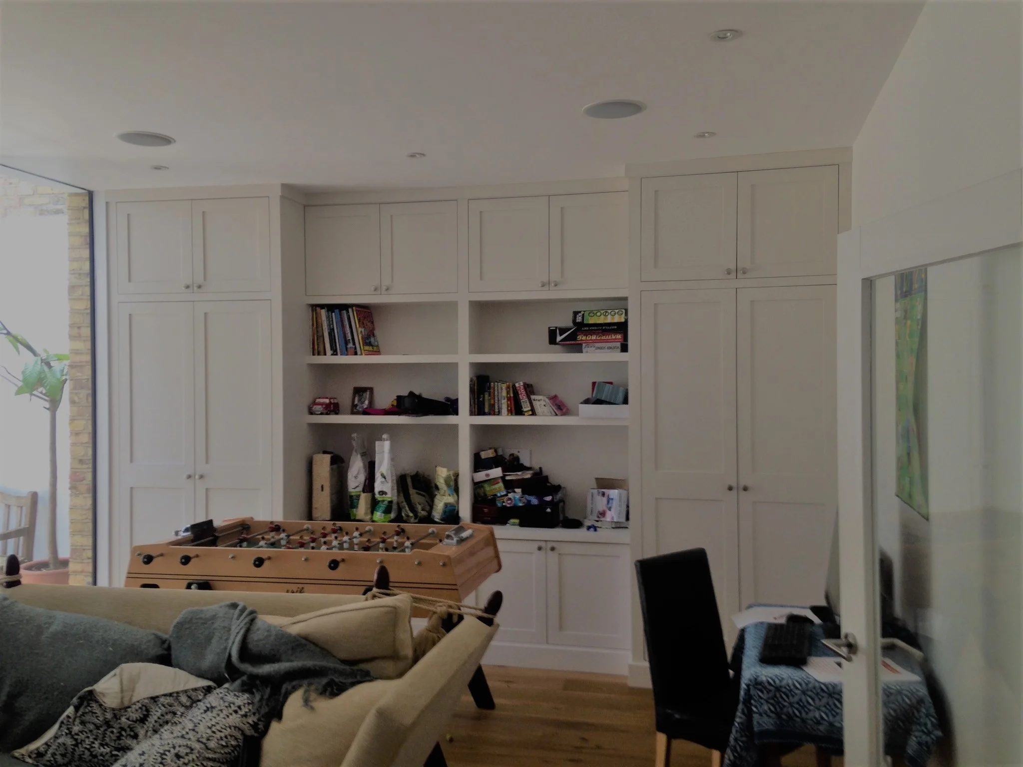 A wardrobe doesn't necessarily have to be in a bedroom. This example really illustrates how it works in a living room.