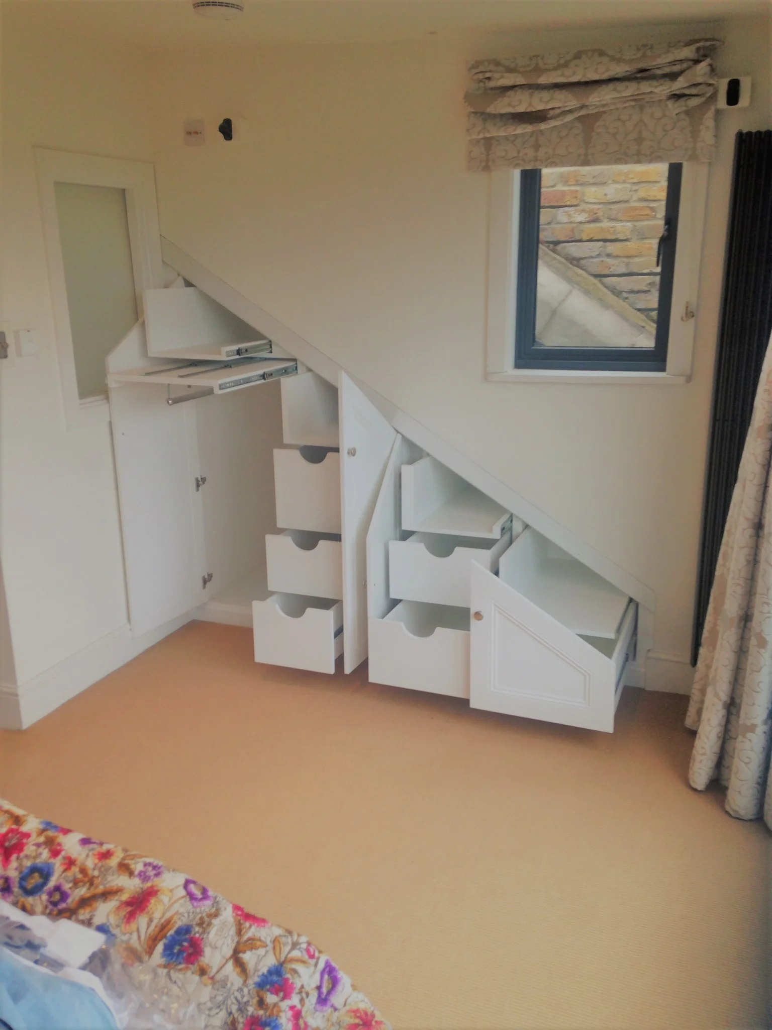 The Perfect example of the many options open to internal configuration. This Angled under stairs unit hides it all within