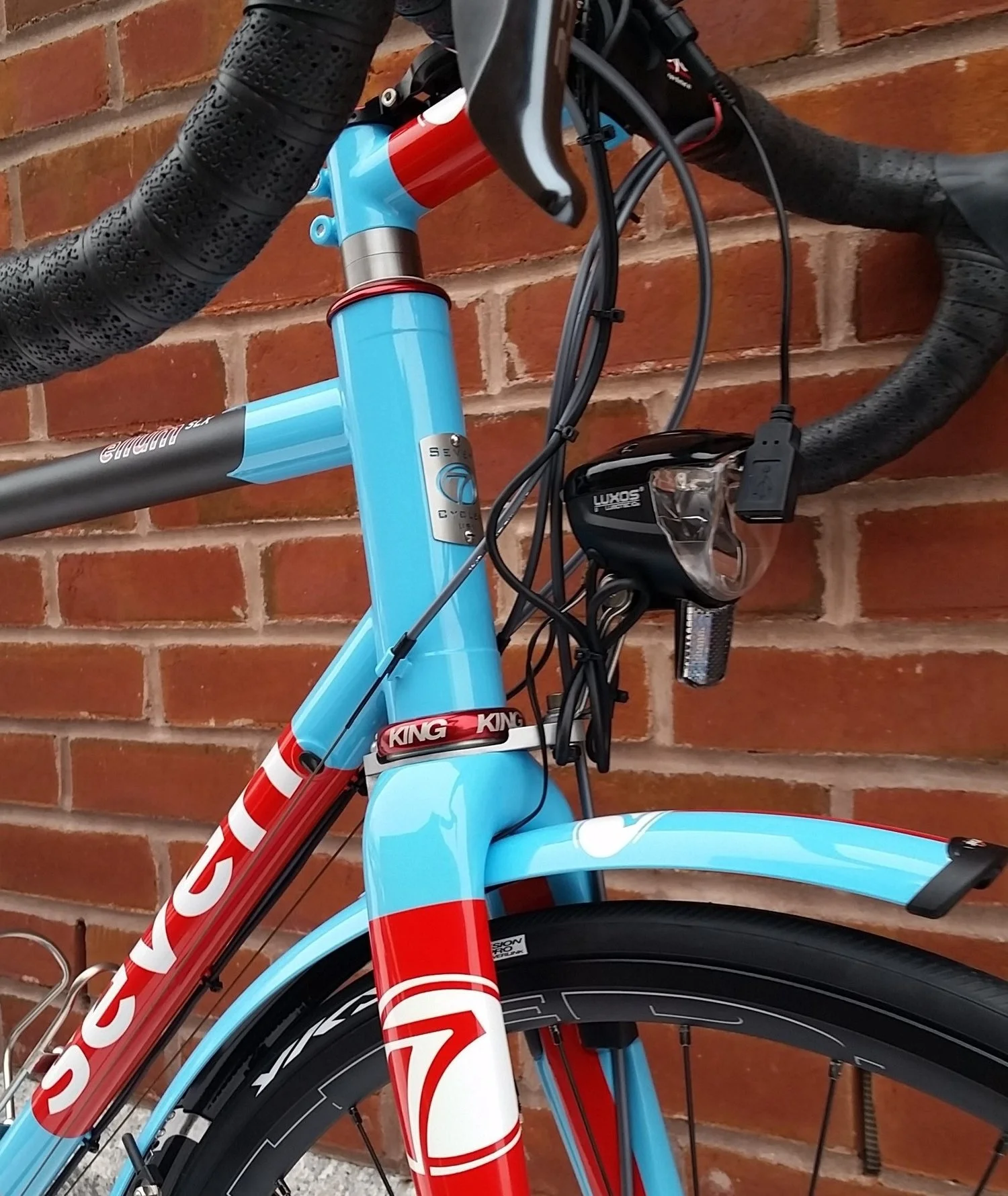 There are great options on the market where it comes to generator lights that allow the bike to ride through the night, cast adequate light for the rider to see, and charge electronics such as the GPS computer and rider’s cell phone. Long-distance rides like PBP mean that almost nothing has enough battery power to last for the duration.