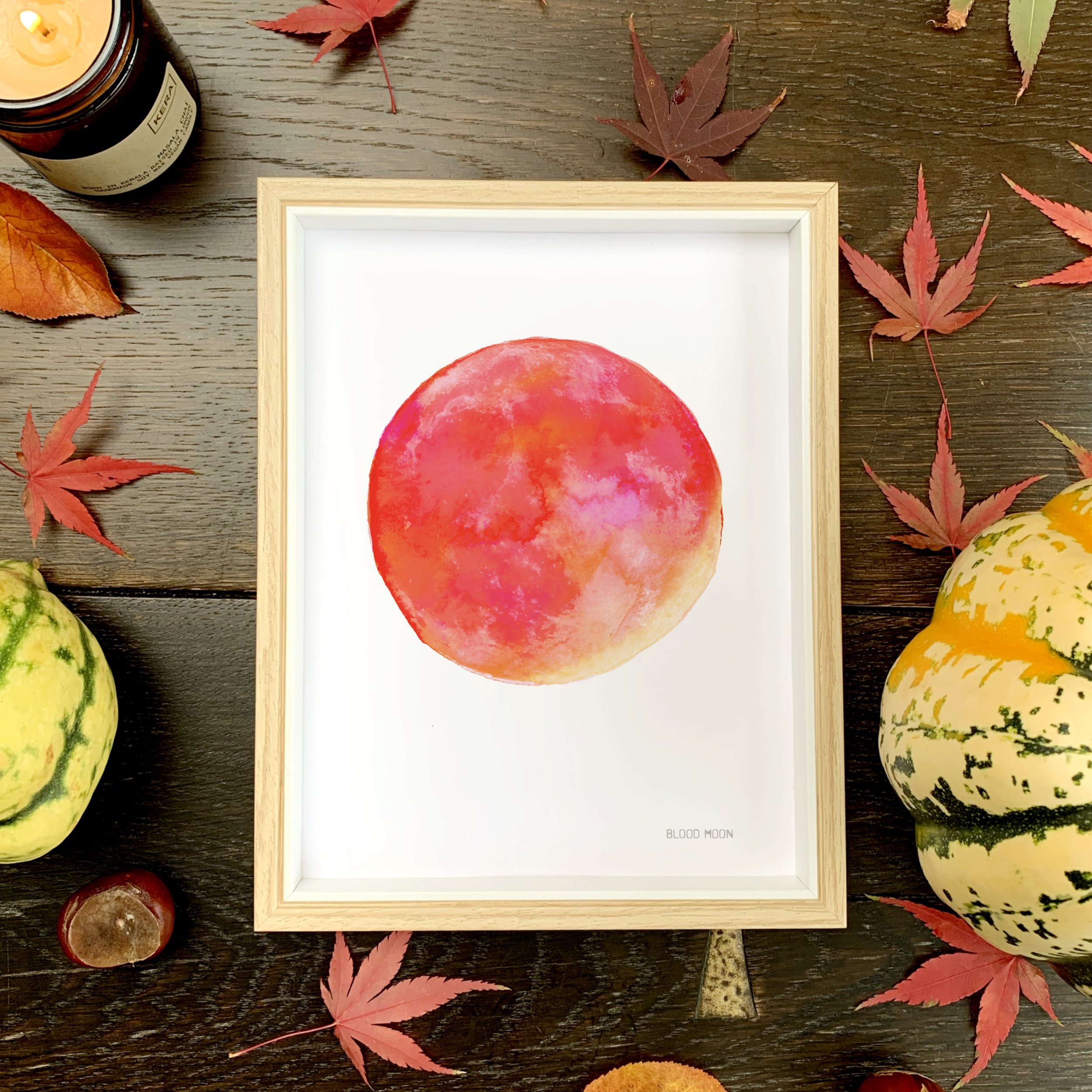Blood Moon Print in Small A5 Frame with leaves candel and pumpkins.jpg