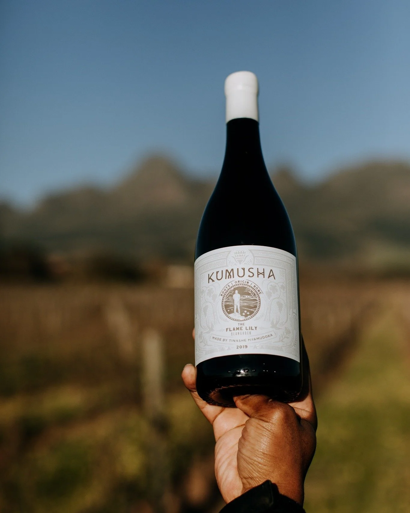 Rooted in heritage, crafted with care!
Kumusha means &ldquo;your home, your roots, your origin&rdquo; in Zimbabwean Shona - a philosophy embraced by sommelier Tinashe Nyamudoka in every bottle.

🍇 The Flame Lily White Blend 2022
Subtle, elegant, and