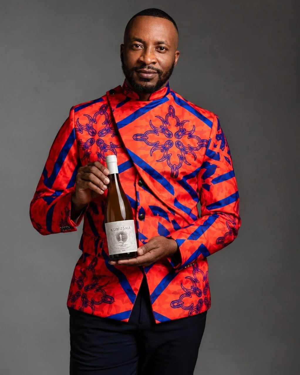 Rooted in South Africa. Carried with pride. Shared with the world.
The Flame Lily by Kumusha is more than a bottle of wine - it is an expression of origin, heritage and place.

Founded by acclaimed sommelier Tinashe Nyamudoka.
The Flame Lily is a whi