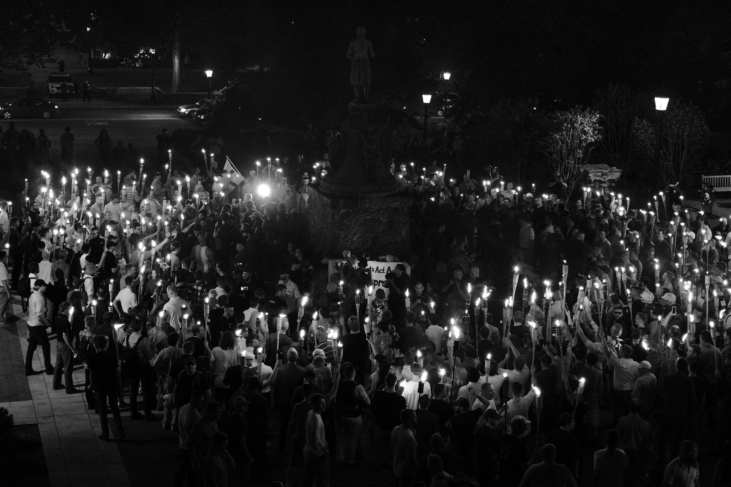  The white supremacists marched through UVA campus until they reached the Thomas Jefferson monument where they surrounded a small group of protesters -- mostly college students -- who encircled the statue protectively. As the students chanted "Black 