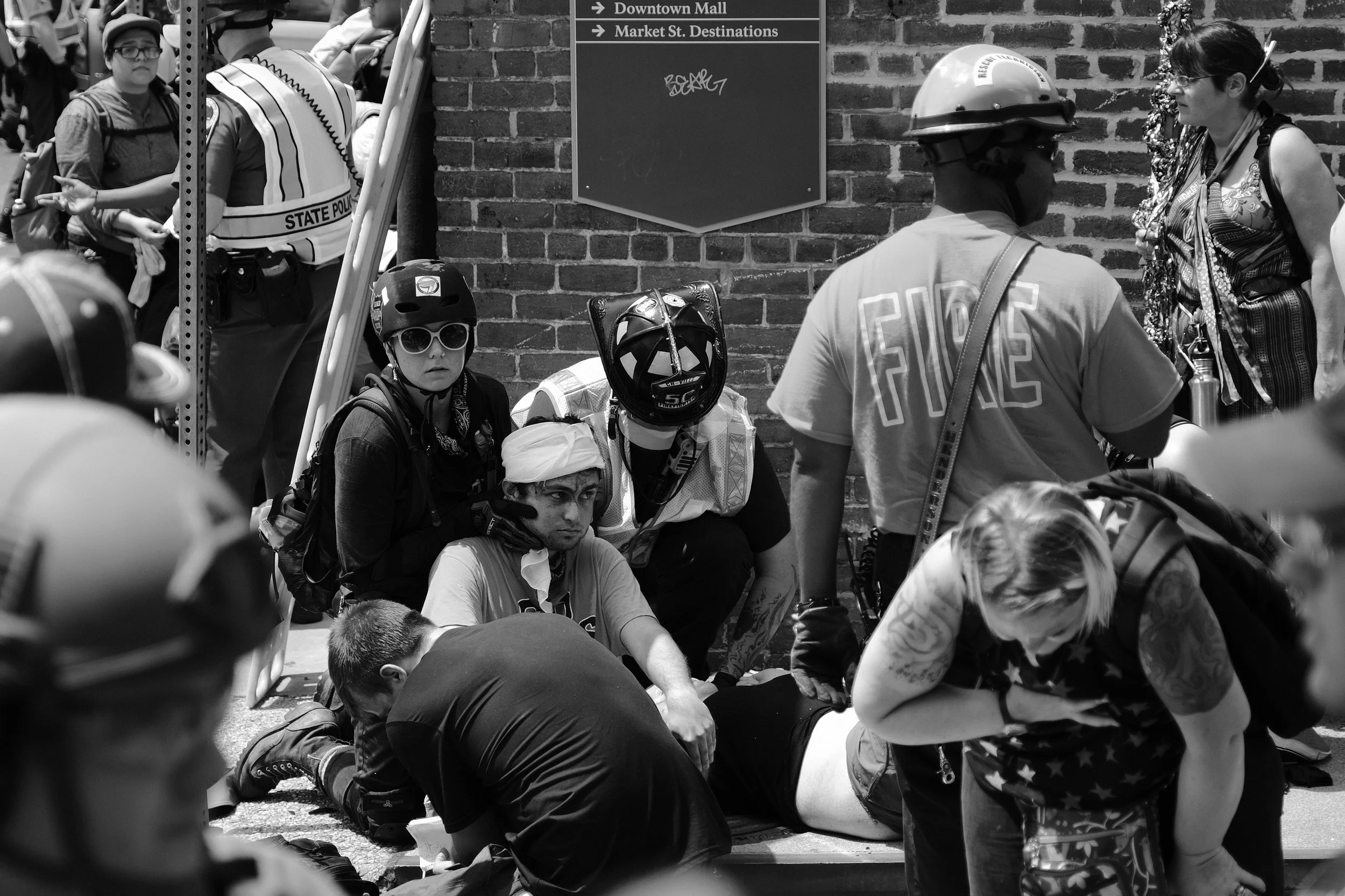 At approximately 1:45 PM, hours after the white supremacists retreated, a car plowed through a crowd of celebrating protesters, killing Heather Heyer and injuring at least 19 others. The car was allegedly driven by James Fields who was arrested and charged with second-degree murder and five other felonies associated with this terrorist attack. Antifascist street medics acted immediately, being closer than Charlottesville first responders. Without their expert medical attention at this critical time, more of the injuries sustained during this attack could have proven fatal.