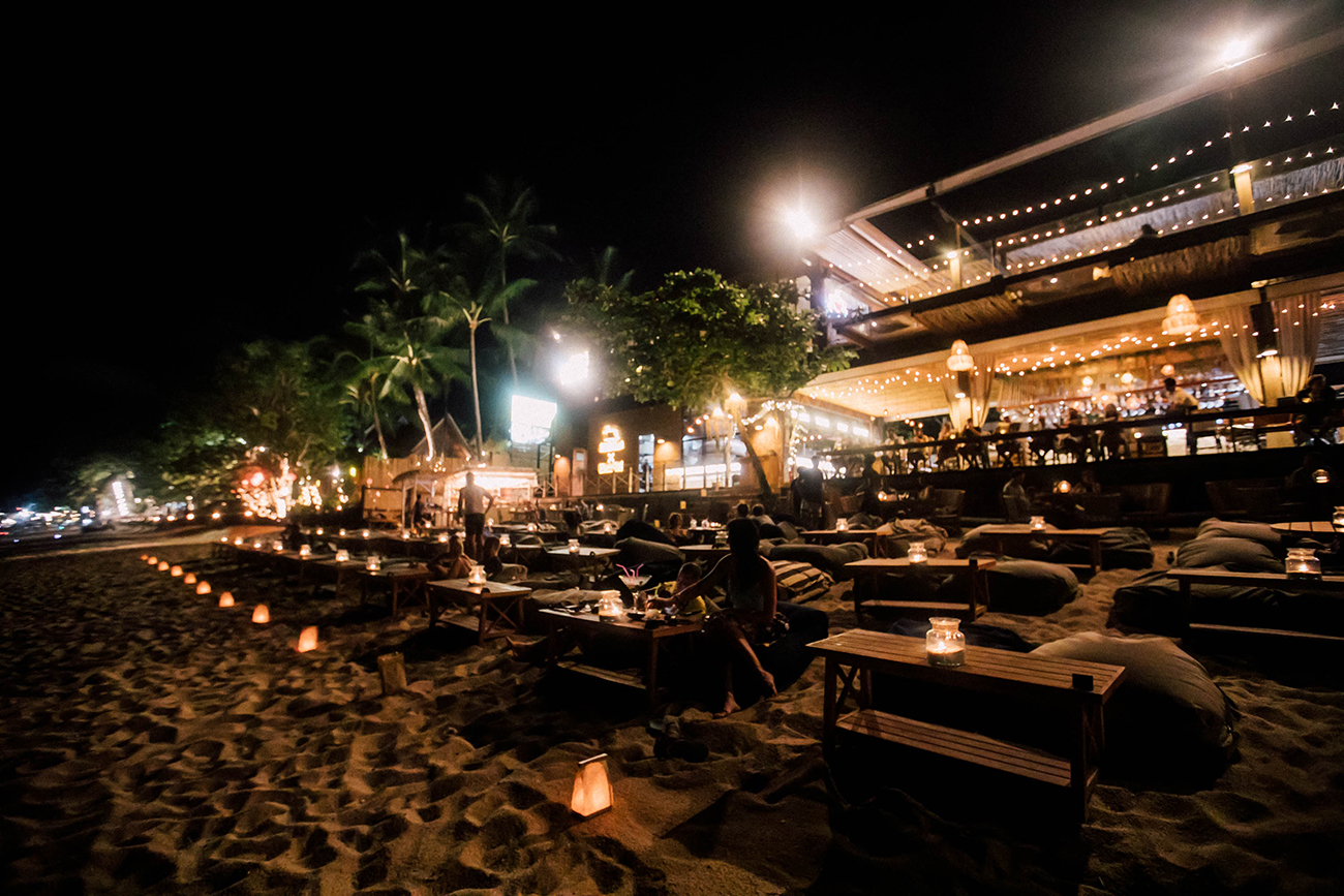 coco tams at night on fisherman's village beach