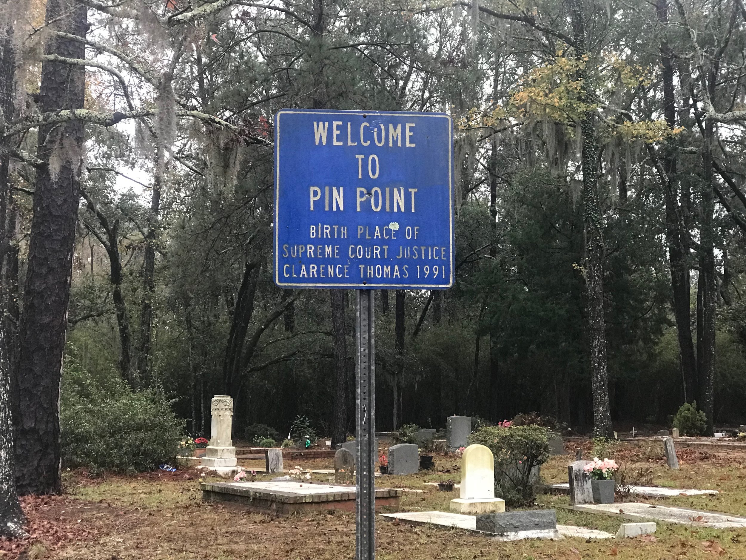  A sign near the cemetery at Sweetfield of Eden Baptist Church - formerly Hinder Me Not Baptist Church - welcomes visitors to Pin Point. 