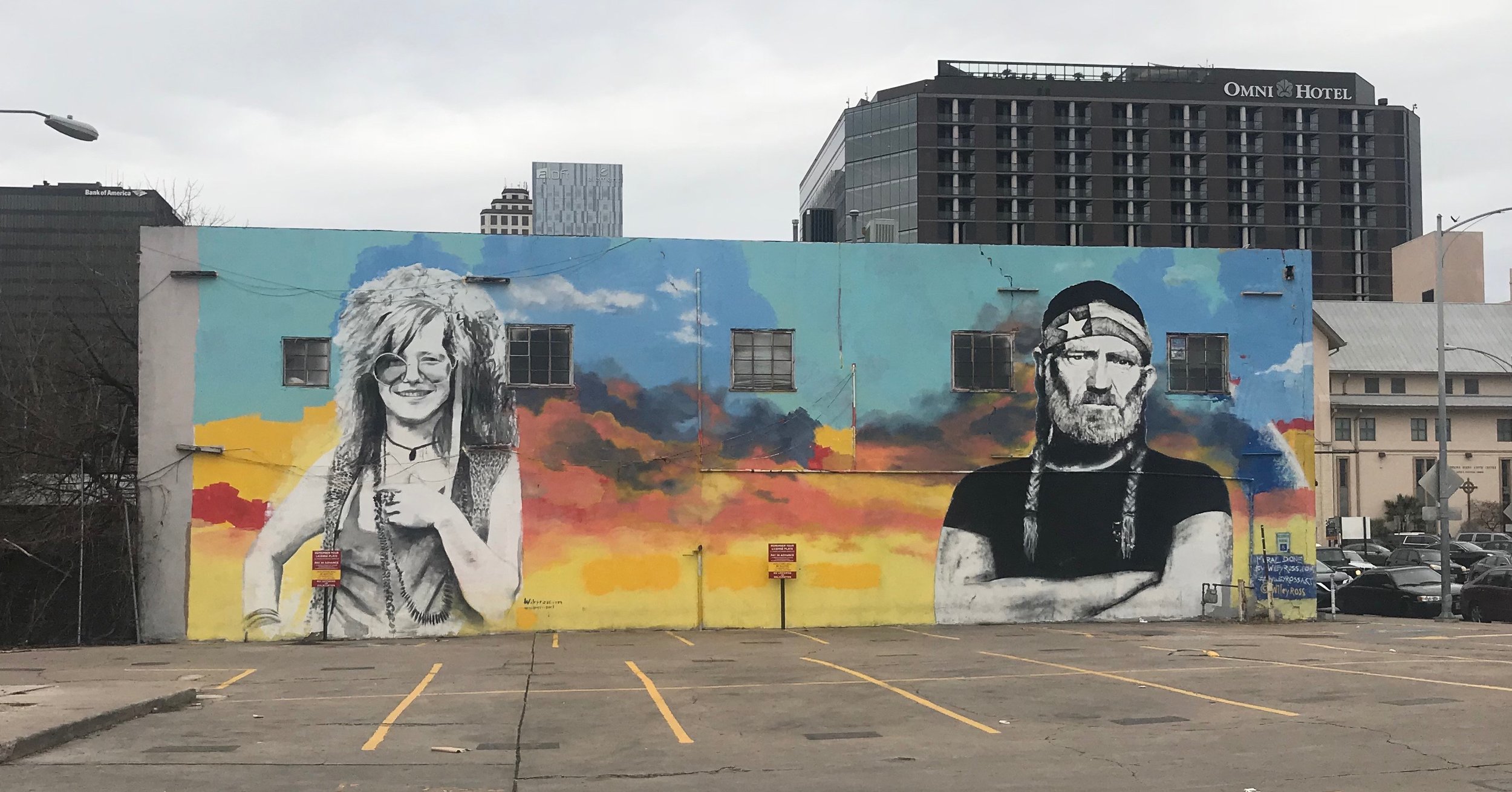  Janis Joplin and Willie Nelson, two Austin icons, keep watch over a downtown parking lot. 