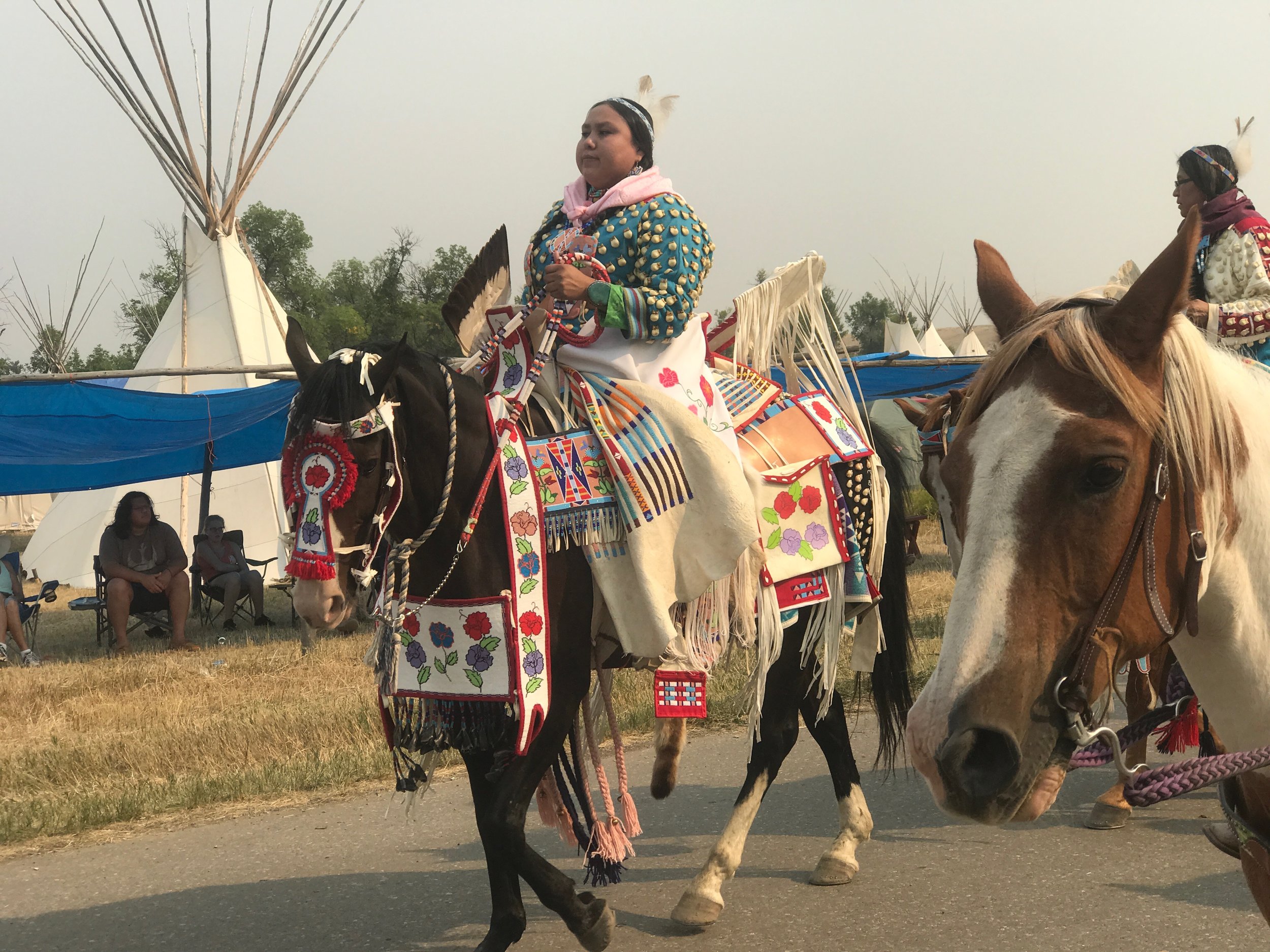  Parading through the encampment in Crow Agency, Montana. 