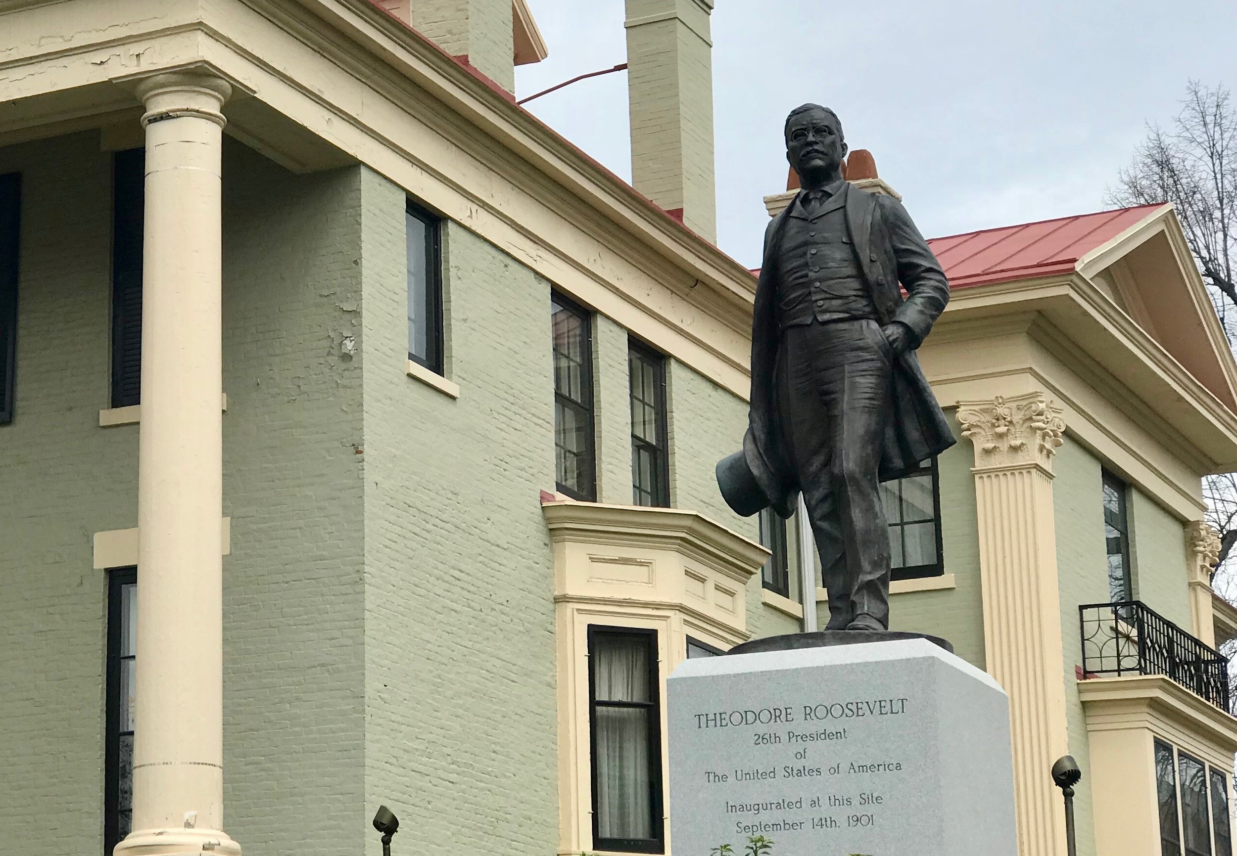  A statue of Theodore Roosevelt stands by the house where he was sworn in as president. 