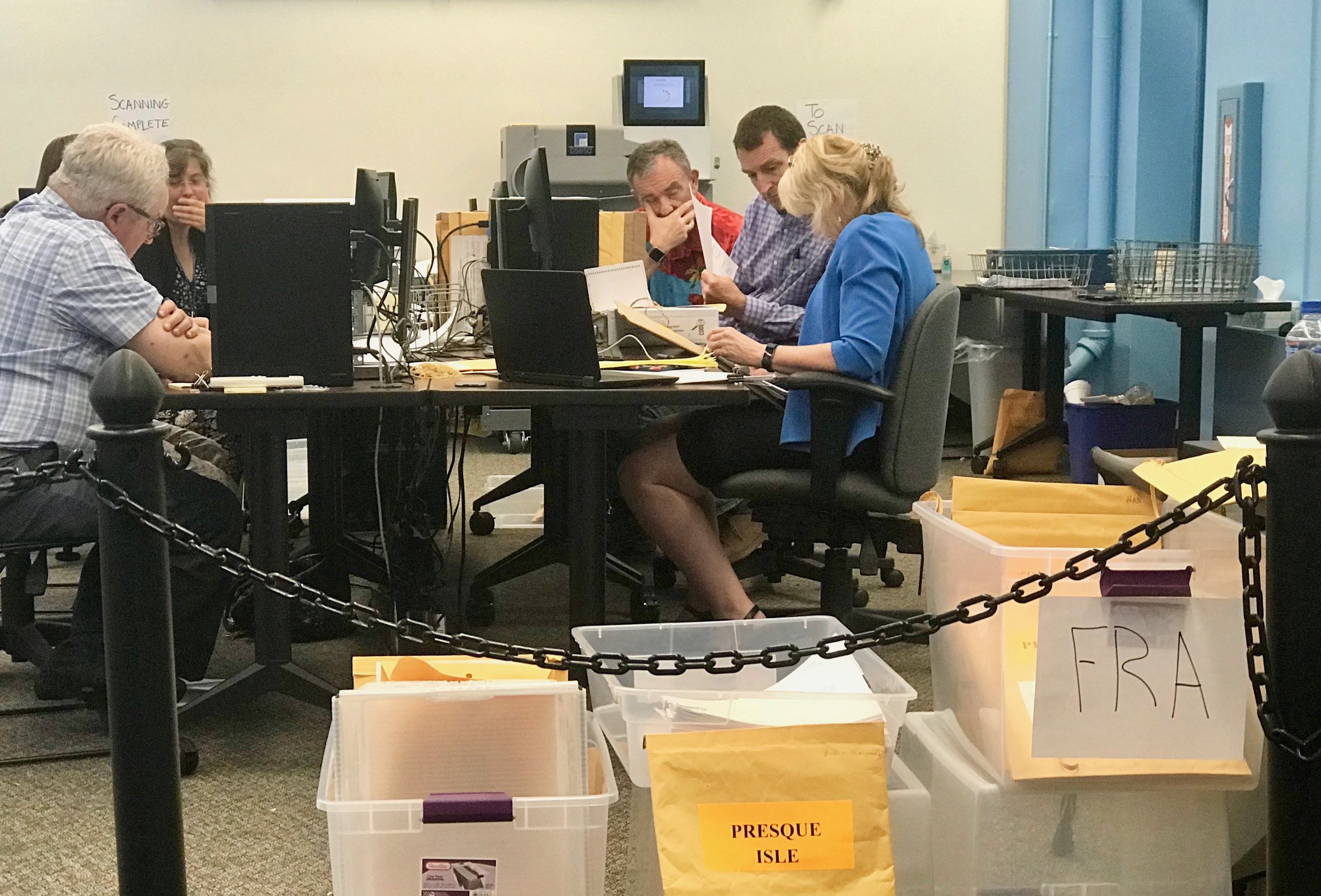  Maine election workers certify ballots before running the ranked-choice voting program to determine the final results of the June 12 primary. 