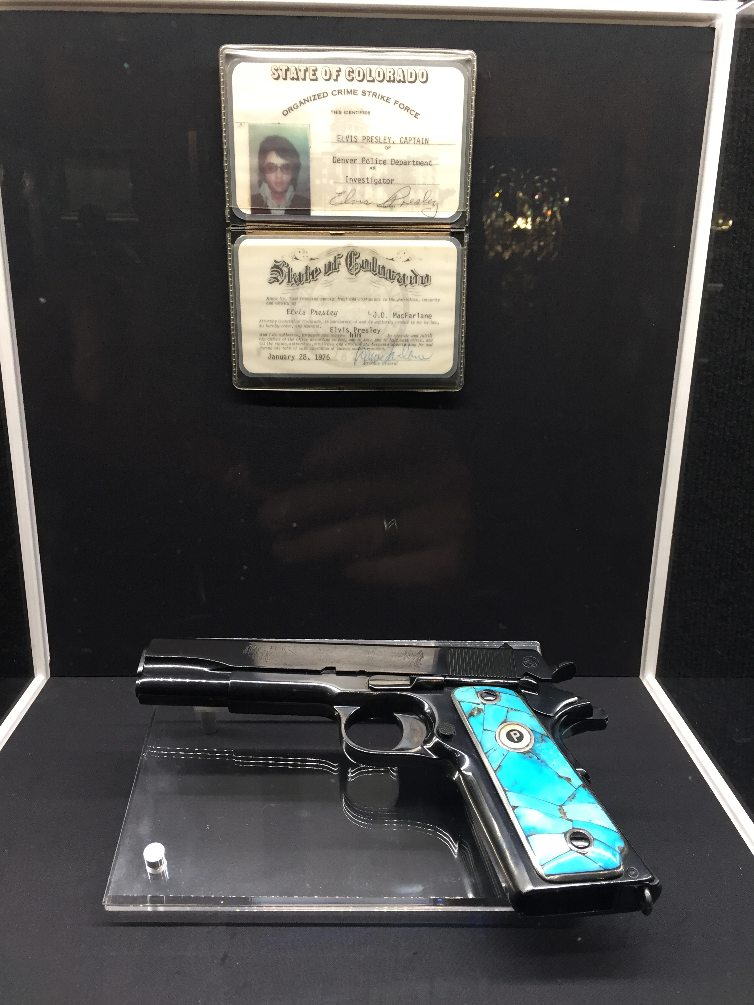  Elvis’ handgun, along with his honorary membership in Colorado’s Organized Crime Strike Force.      