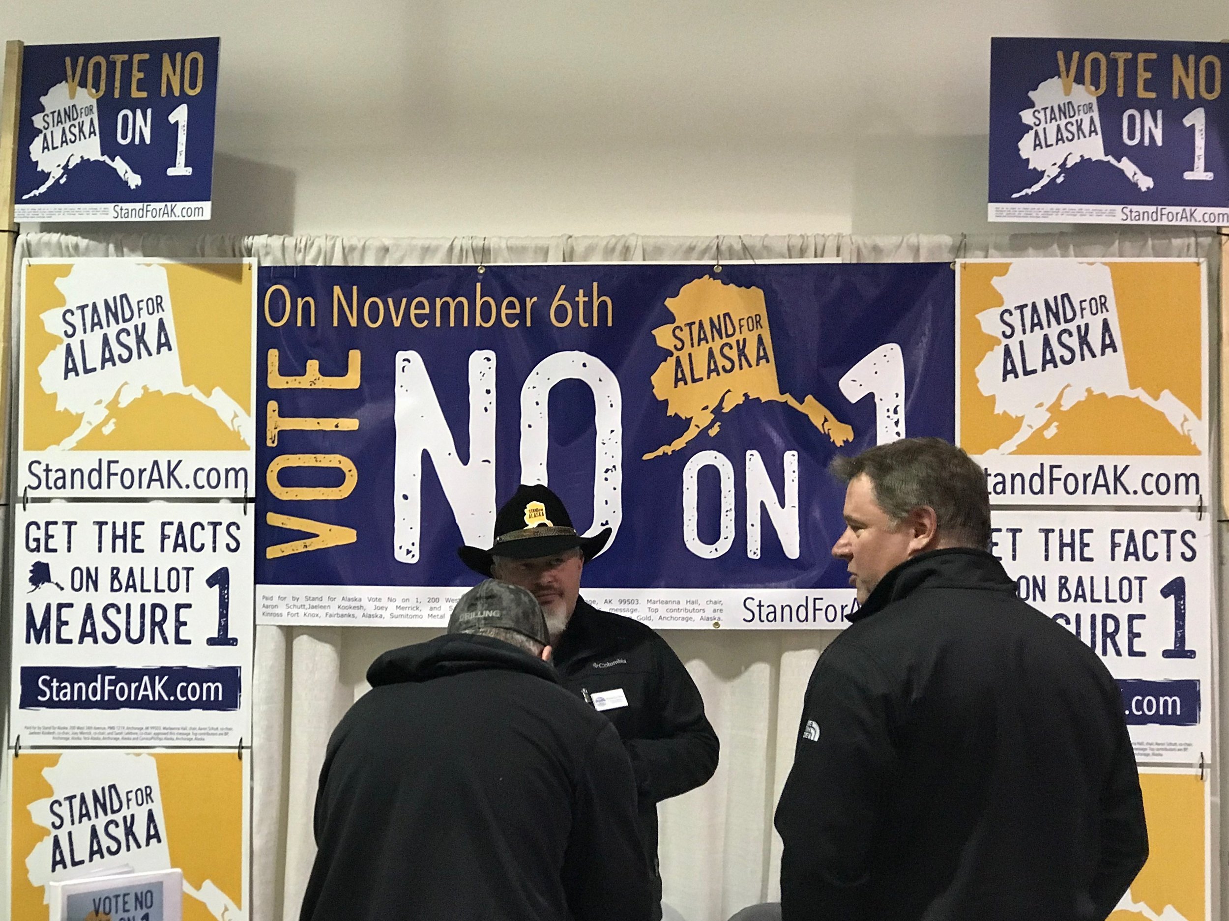  Opponents of the “Stand for Salmon” initiative lobby visitors to the Alaska State Fair.      