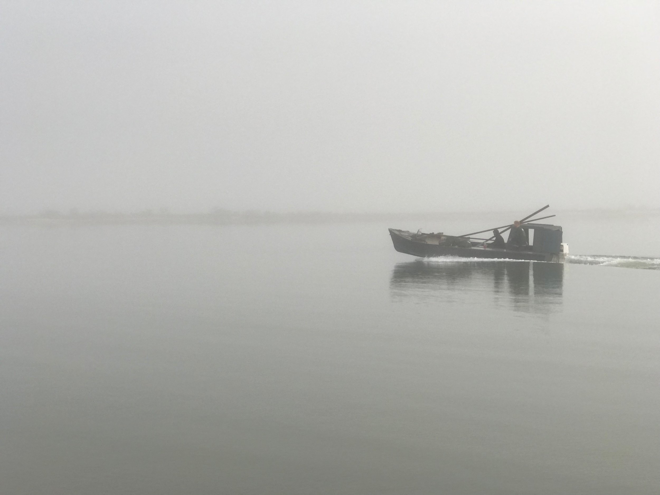  An oyster boat returns to foggy Eastpoint, Fla., after a long day     