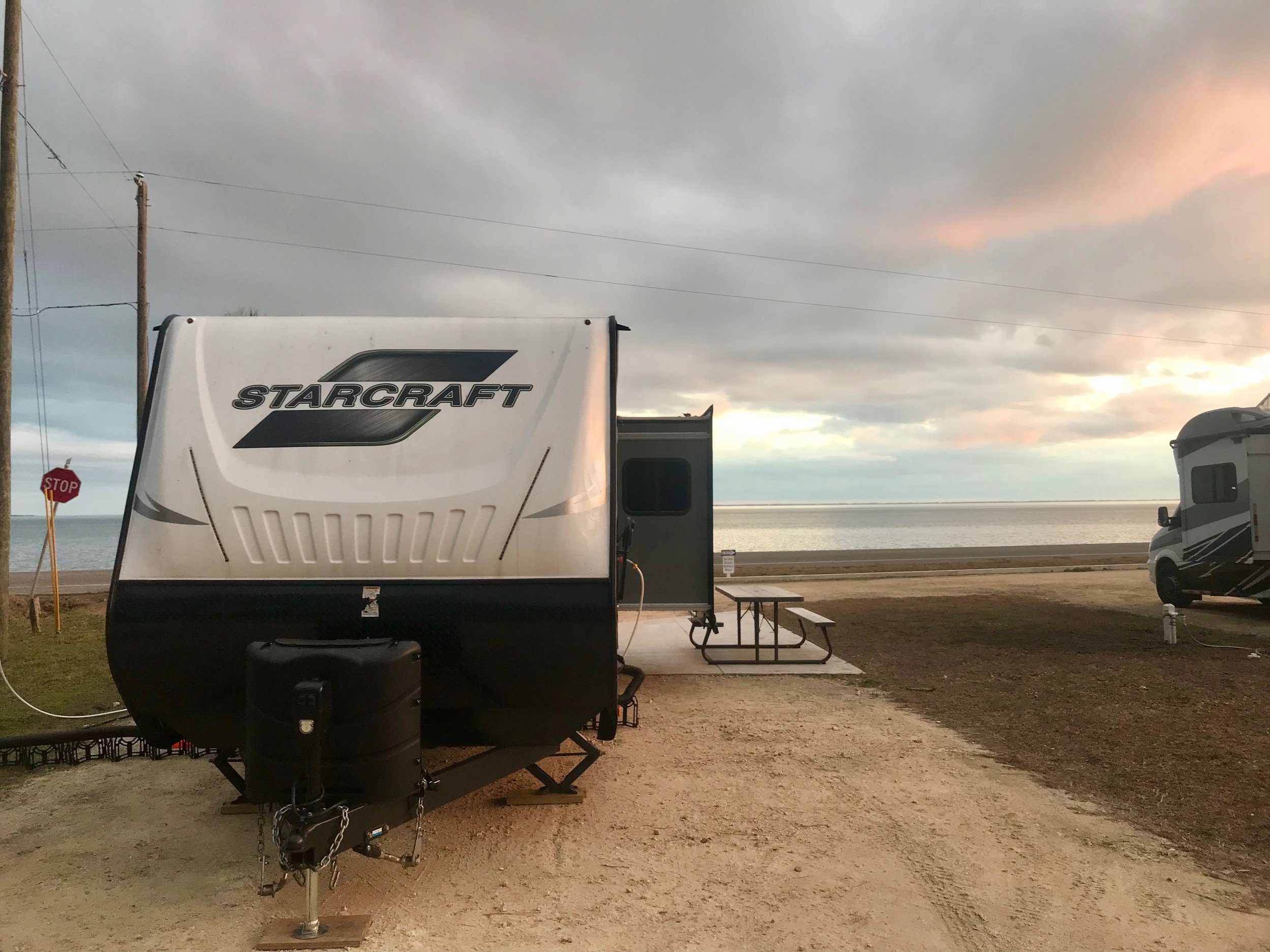  Our trailer, parked across Rte. 98 from the Gulf. 