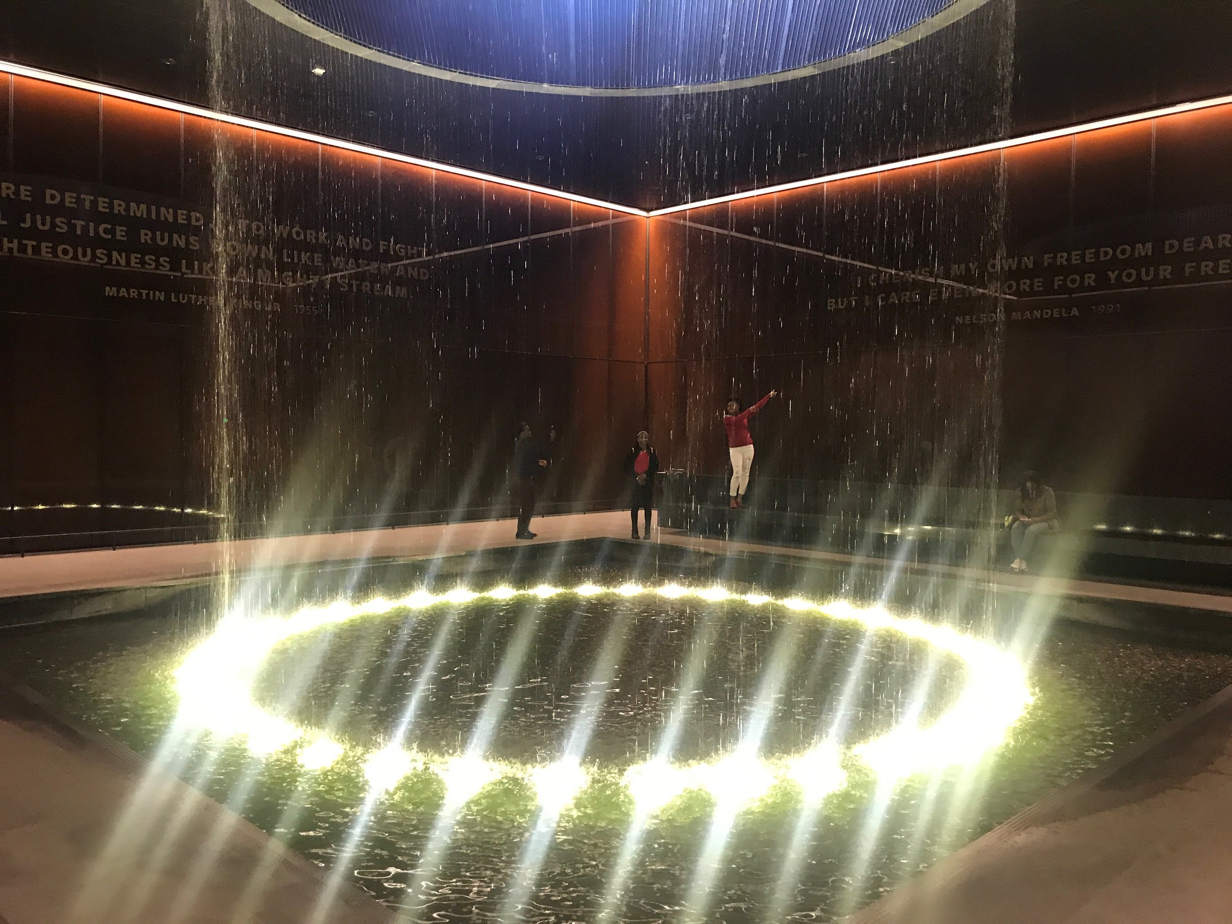  An indoor waterfalls provides a contemplative spot inside the National Museum of African American History and Culture.      