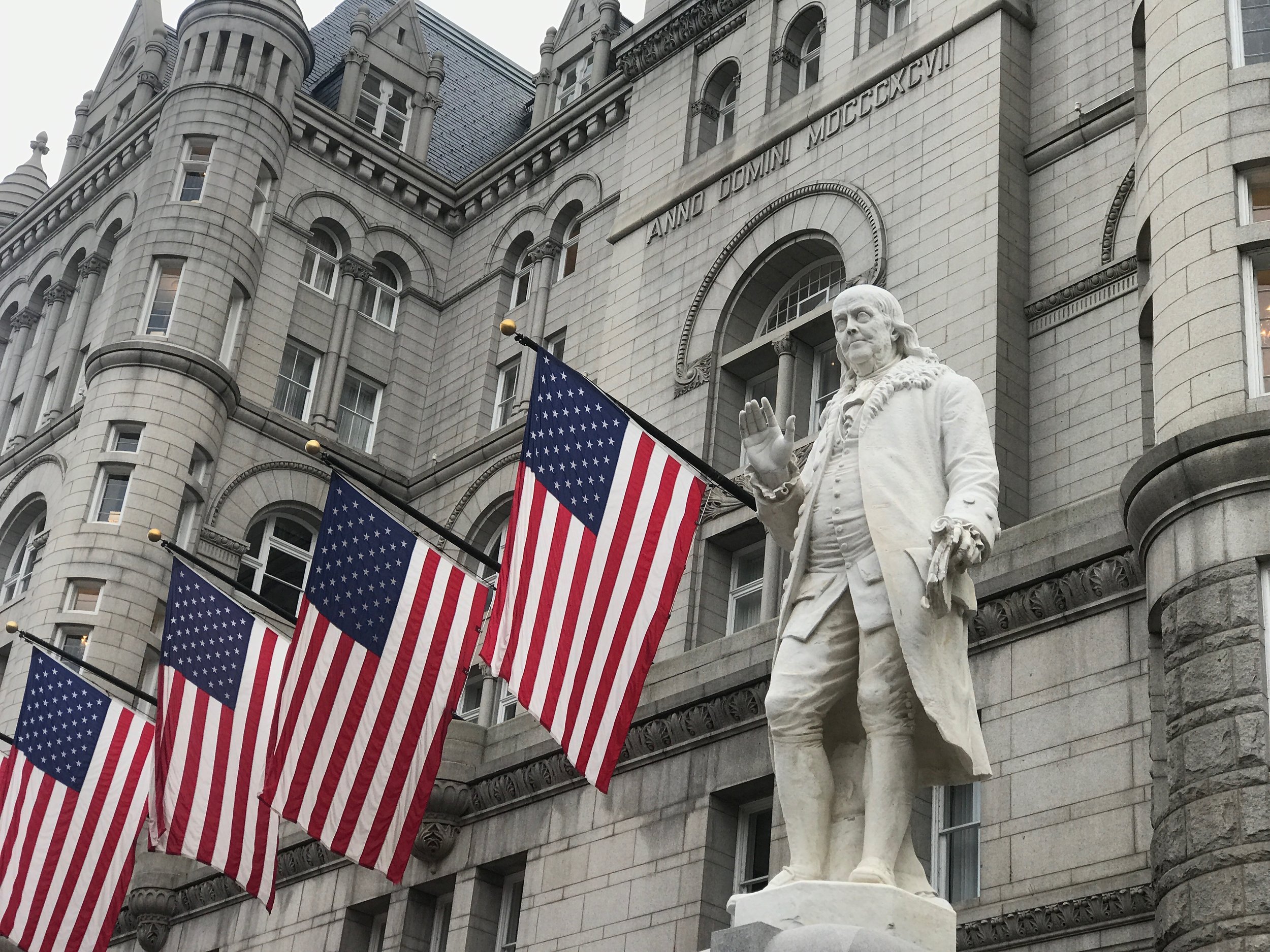  A statue of Benjamin Franklin, who served as the nation’s first postmaster general, stands outside the former Post Office Building in Washington, which is now home of the Trump International Hotel.      
