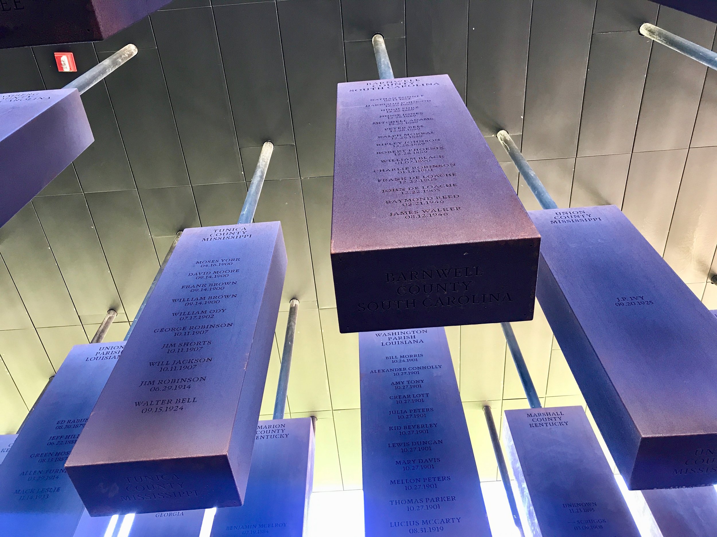  Steel slabs bearing the names of lynching victims killed between the Civil War and 1949 hang at the National Memorial for Peace and Justice in Montgomery, Alabama.      
