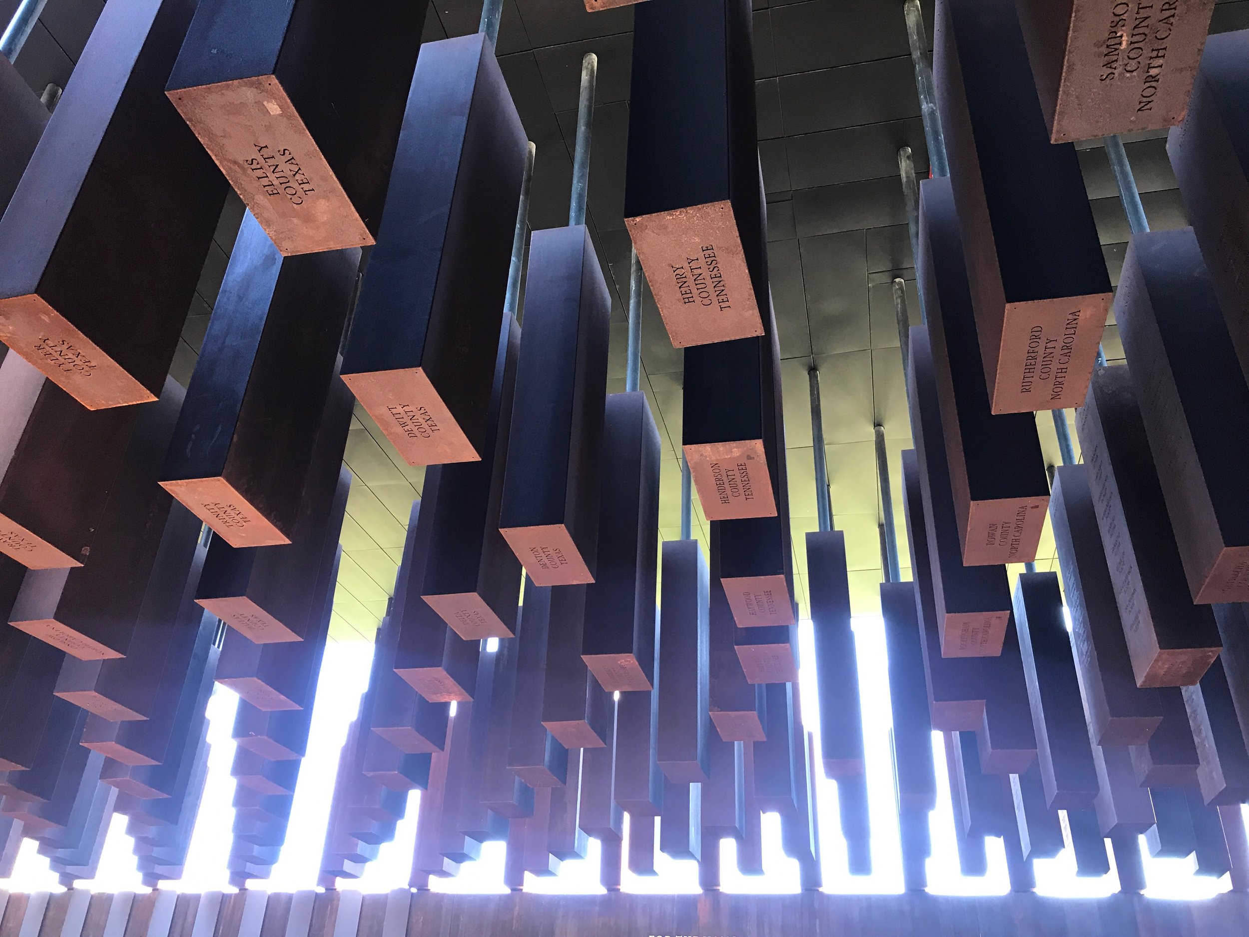  Steel slabs bearing the names of lynching victims killed between the Civil War and 1949 hang at the National Memorial for Peace and Justice in Montgomery, Alabama.      