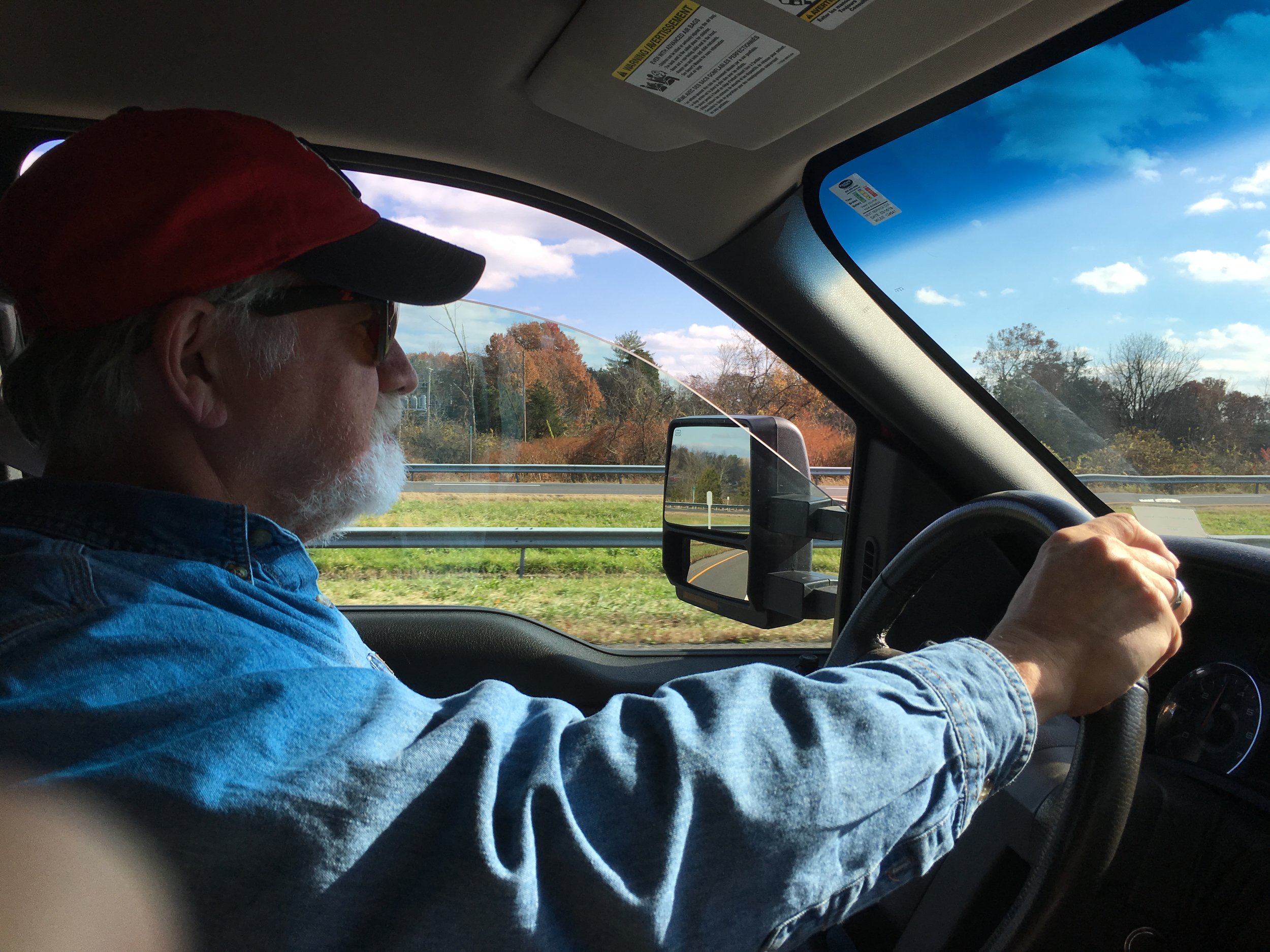  Columnist Rick Holmes behind the wheel of his truck, somewhere in the Midwest.      