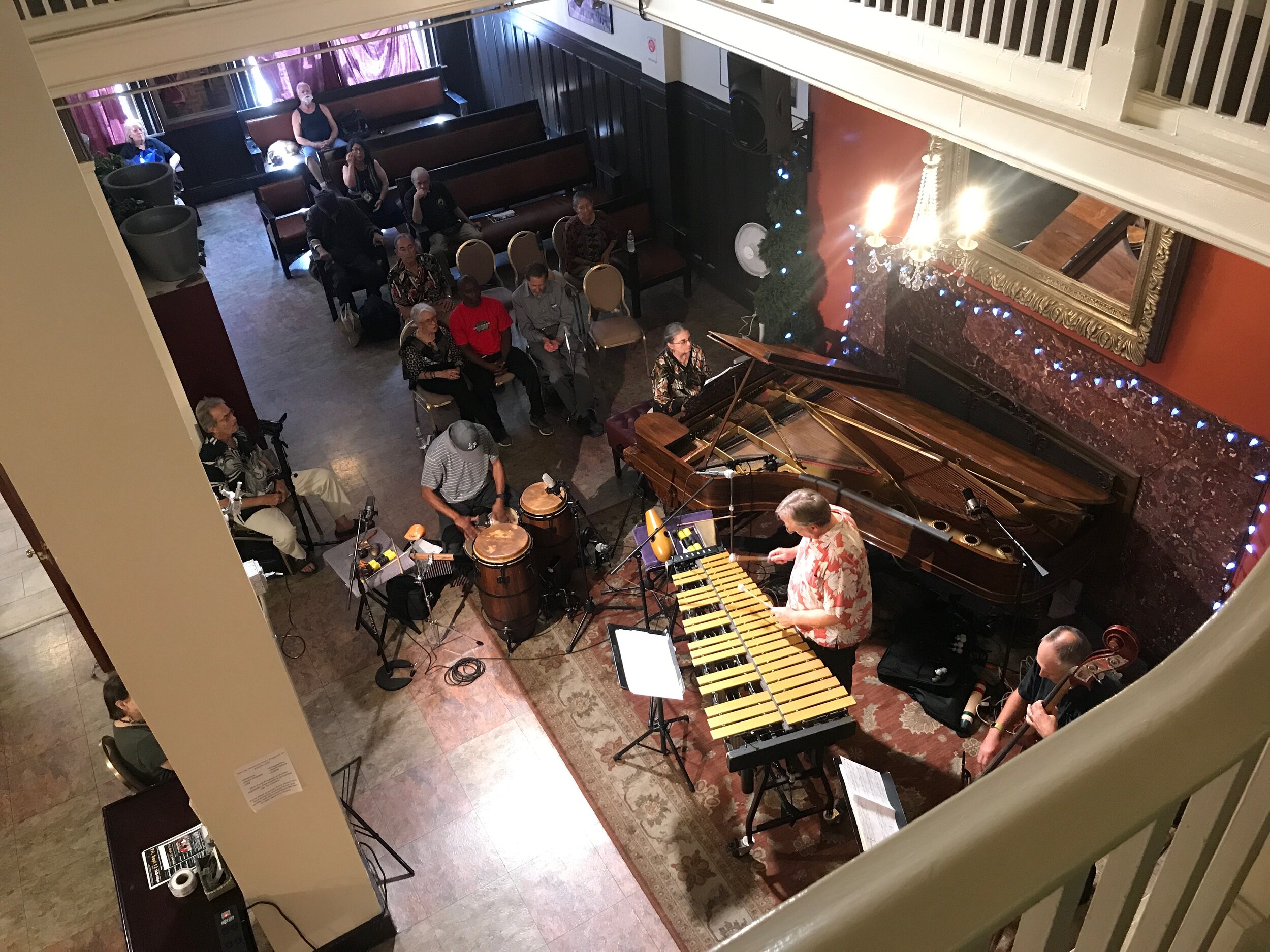  A jazz group performs a free concert in the lobby of the Cadillac Hotel, one of the residential hotels that came to characterize San Francisco's Tenderloin district. Most are now owned by nonprofit organizations who rent single rooms to low-income i