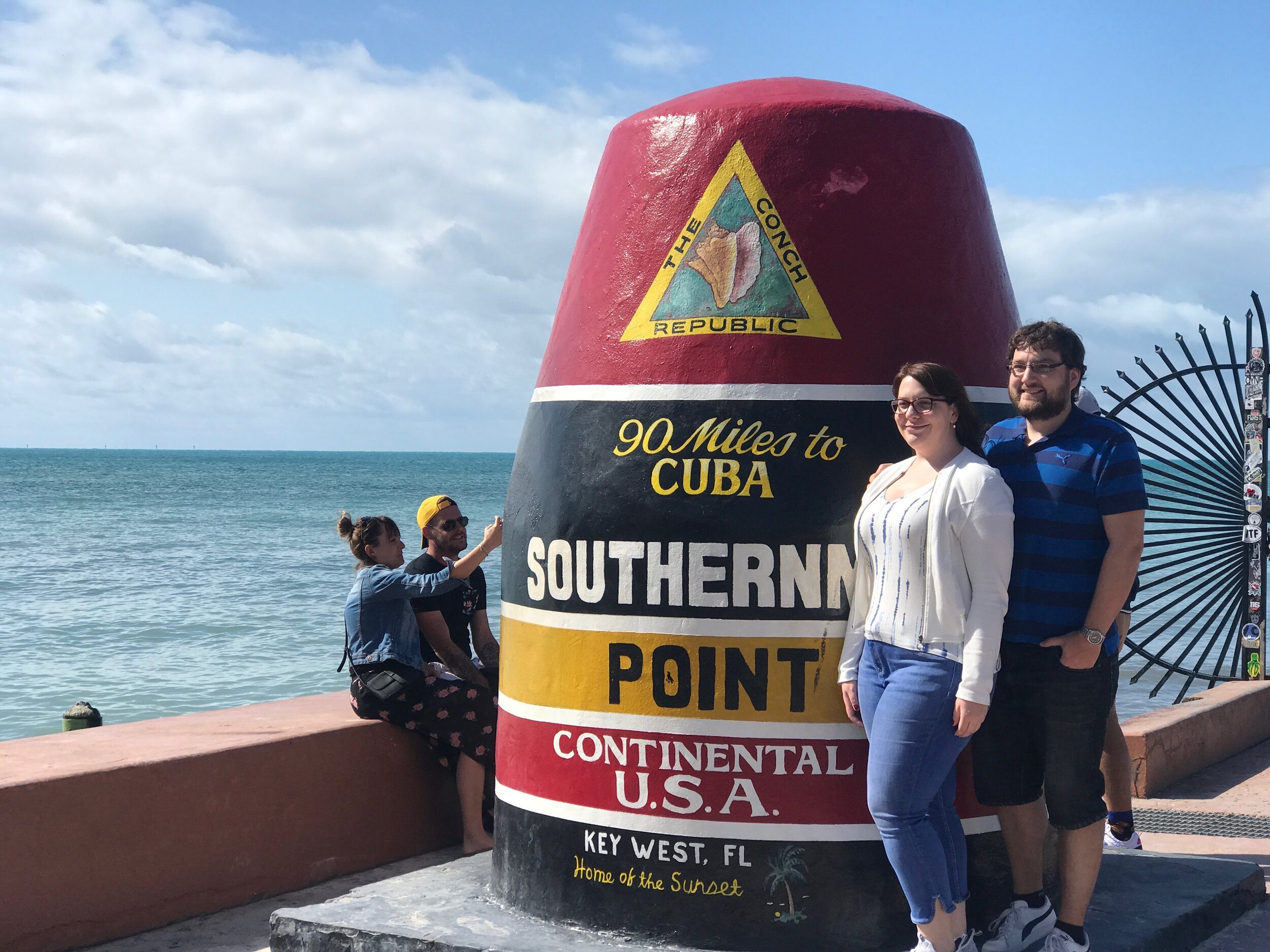  At the southernmost point of Key West, tourists gather to look toward Cuba. 