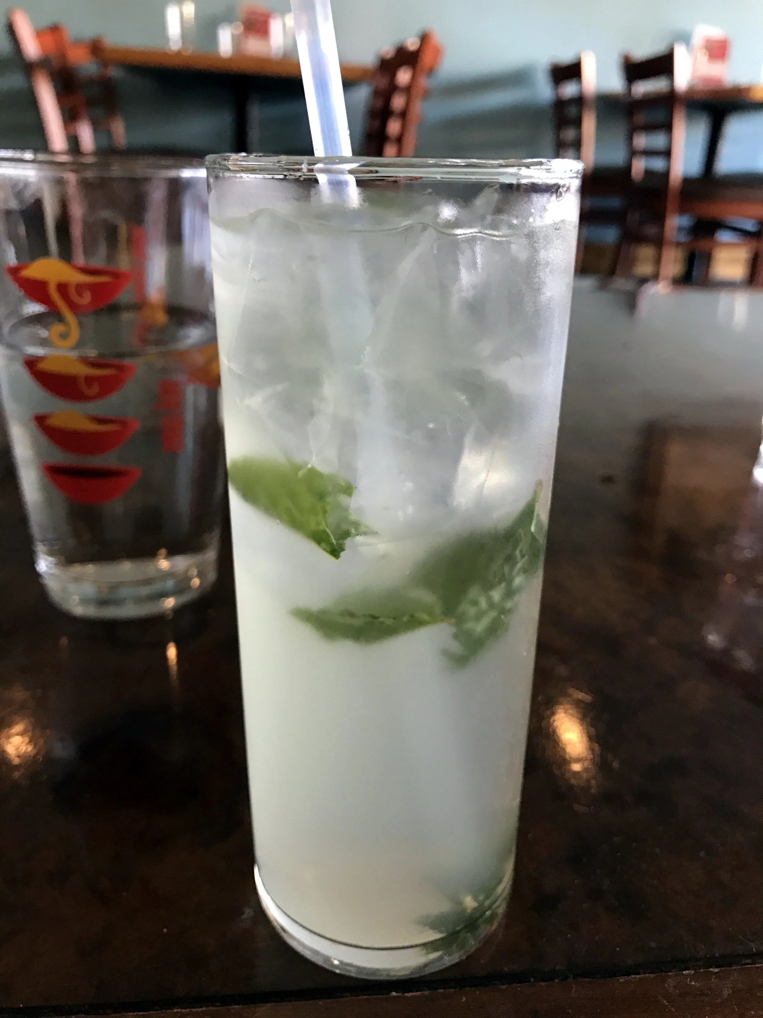 The Sugar & Spice: a white wine cocktail with mint, lychee, and a homemade Thai chili syrup